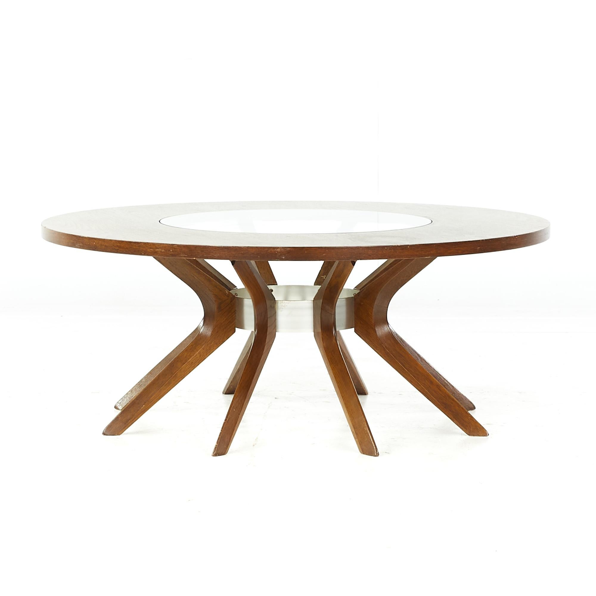 Broyhill Brasilia midcentury walnut cathedral coffee table

This table measures: 40 wide x 40 deep x 16 inches high

All pieces of furniture can be had in what we call restored vintage condition. That means the piece is restored upon purchase so