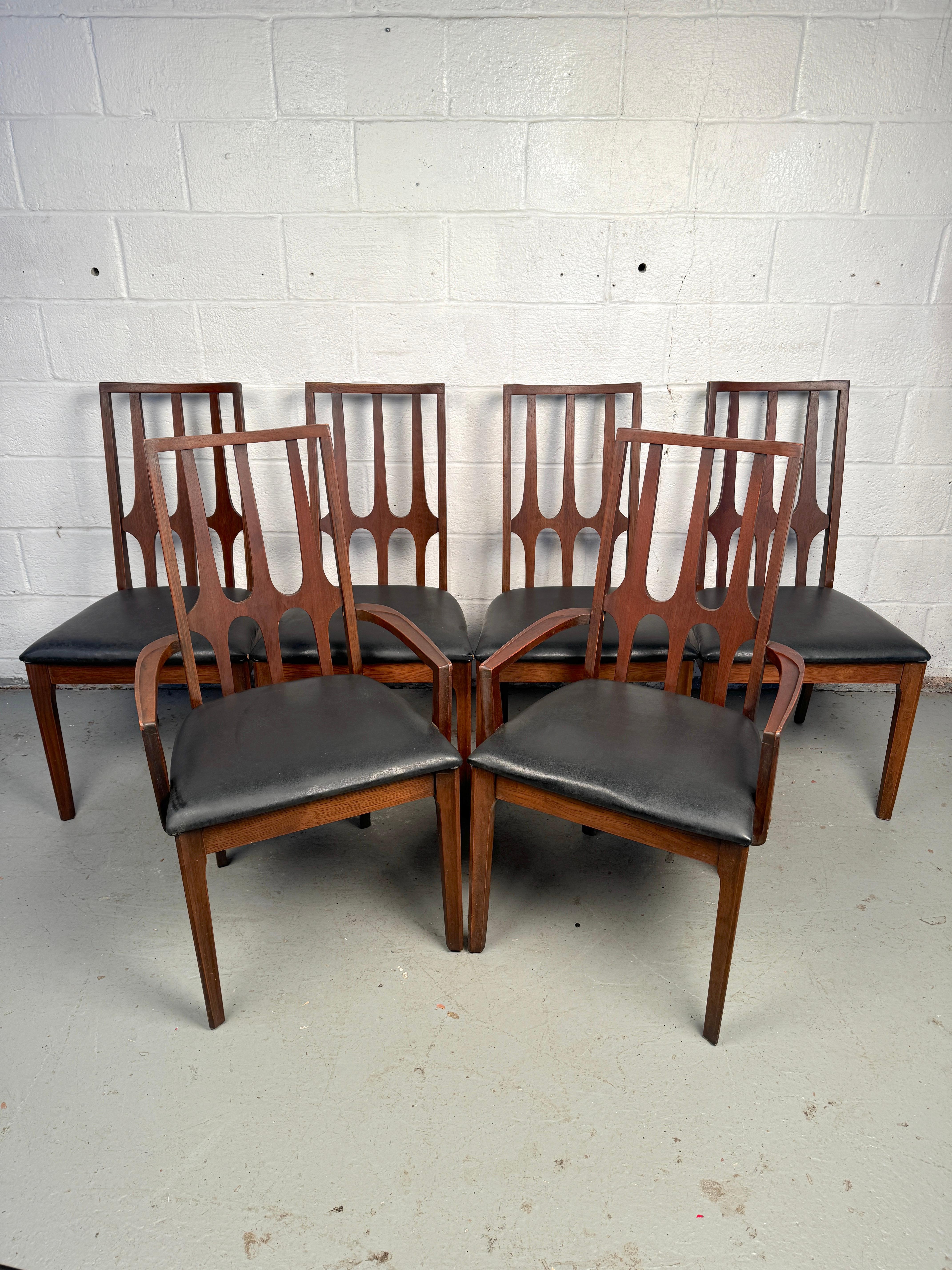 Make a bold statement with this rare set of six Broyhill “Brasilia” dining chairs, a celebrated icon of American mid-century modern design. Crafted in the 1960s as part of Broyhill’s acclaimed Brasilia line, these chairs feature the signature