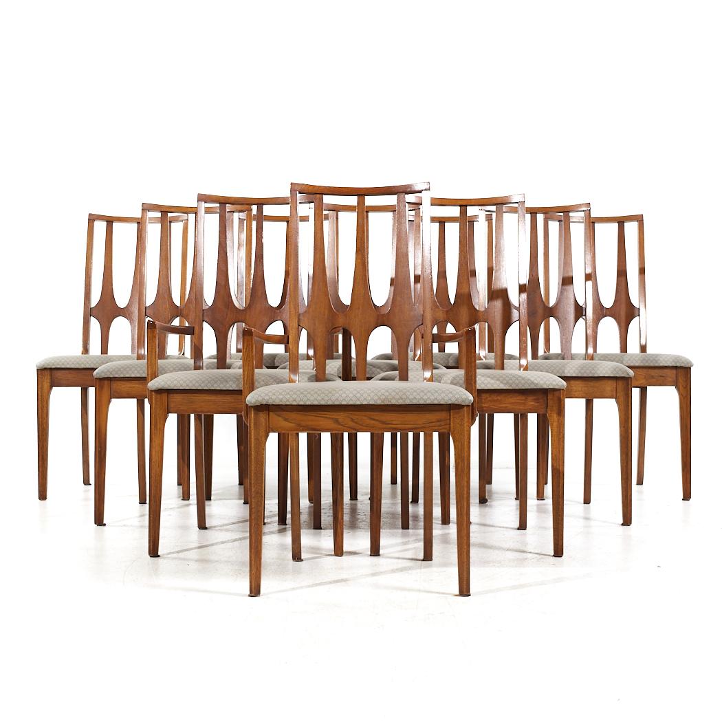 Broyhill Brasilia Mid Century Walnut Dining Chairs - Set of 10

Each armless chair measures: 20 wide x 18.5 deep x 37.75 high, with a seat height of 18 inches
Each captains chair measures: 21.25 wide x 18.5 deep x 37.75 high, with a seat height of
