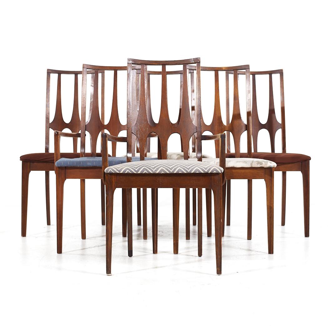 Broyhill Brasilia Mid Century Walnut Dining Chairs - Set of 6

Each armless chair measures: 20 wide x 18.5 deep x 37.75 high, with a seat height of 18 inches
Each captains chair measures: 21.25 wide x 18.5 deep x 37.75 high, with a seat height of 18