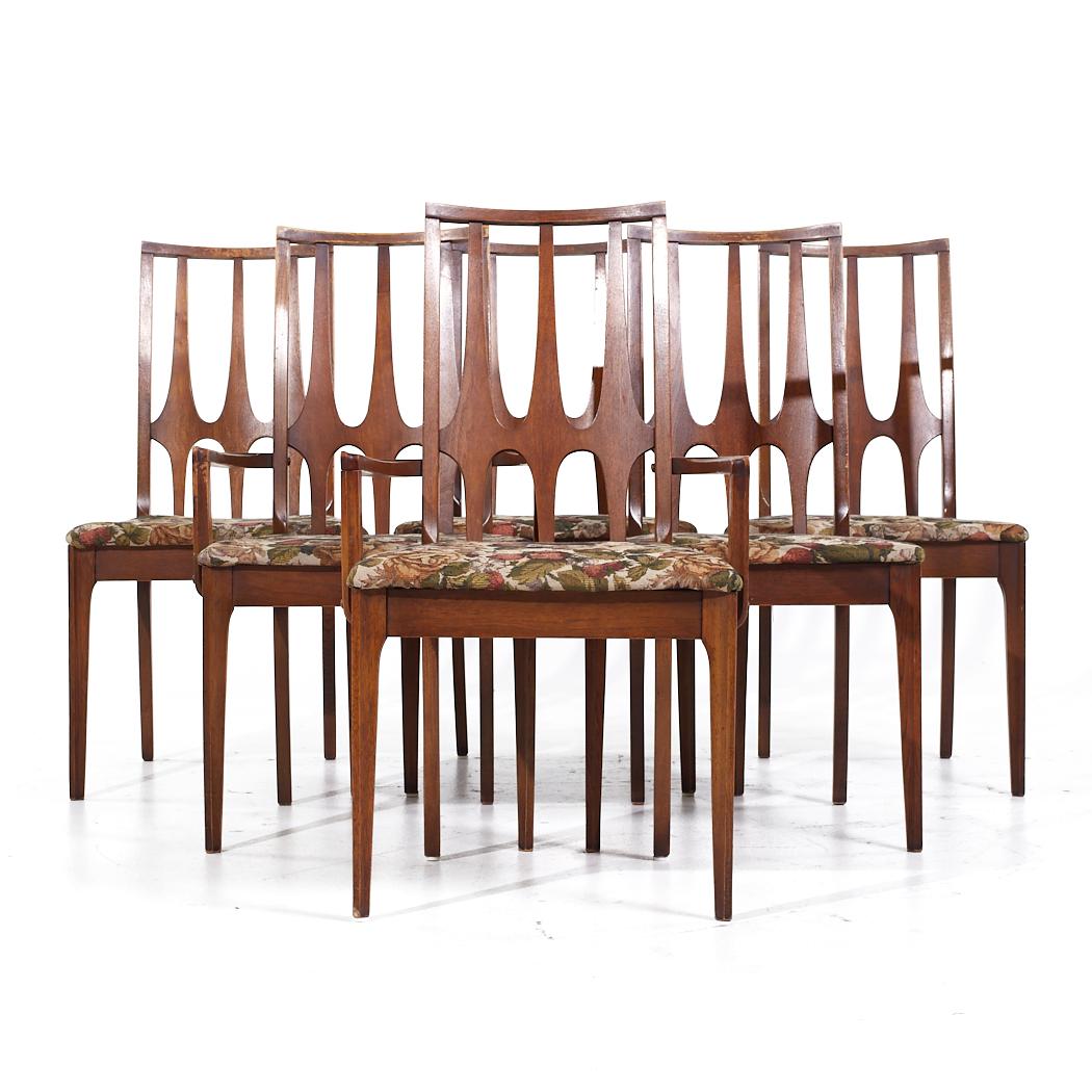 Broyhill Brasilia Mid Century Walnut Dining Chairs - Set of 6

Each armless chair measures: 21.25 wide x 18.5 deep x 38 high, with a seat height of 19 inches
Each captains chair measures: 21.25 wide x 18.5 deep x 38 high, with a seat height of 19