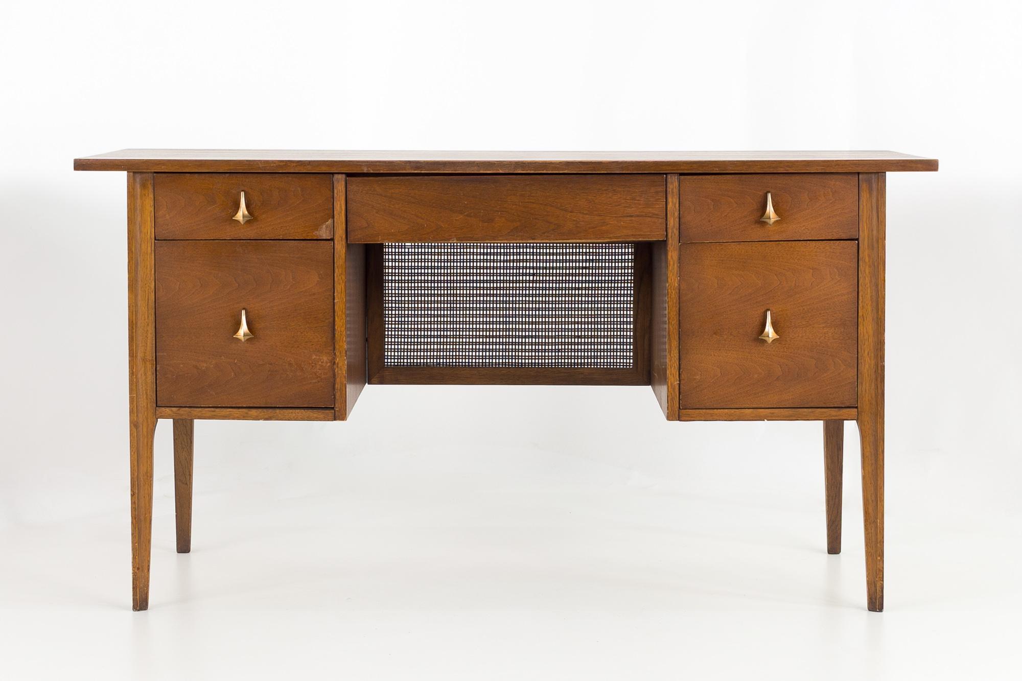 Broyhill Brasilia mid century walnut executive desk
Desk measures 56 wide x 23.25 deep x 30 inches high; Knee hole measures 21 wide x 22 deep x 24.5 inches high

All pieces of furniture can be had in what we call restored vintage condition. That