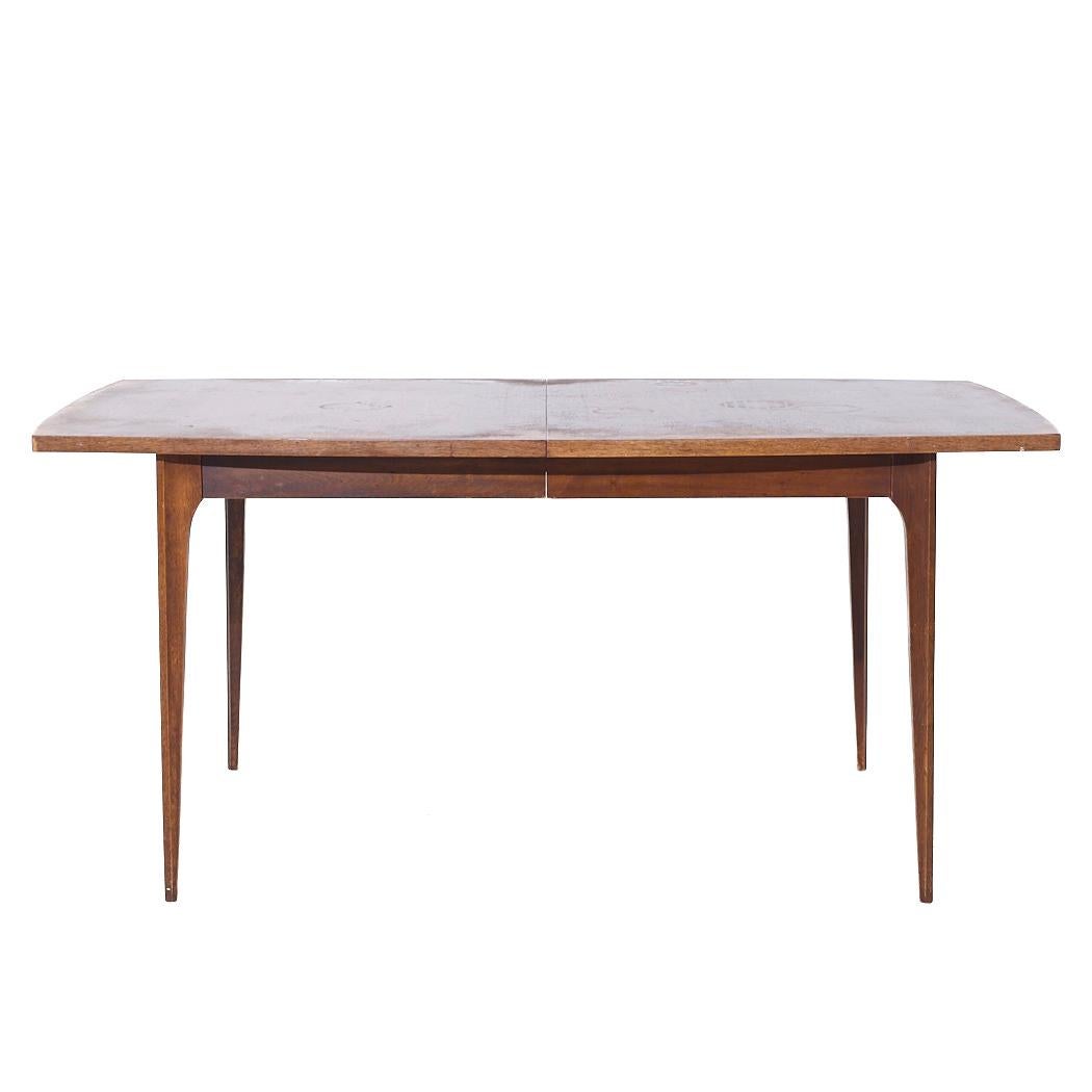 Broyhill Brasilia Mid Century Walnut Expanding Dining Table with 1 Leaf

This table measures: 66 wide x 40 deep x 29.75 inches high, with a chair clearance of 28.5 inches, the leaf measures 12 inches wide, making a maximum table width of 78 inches