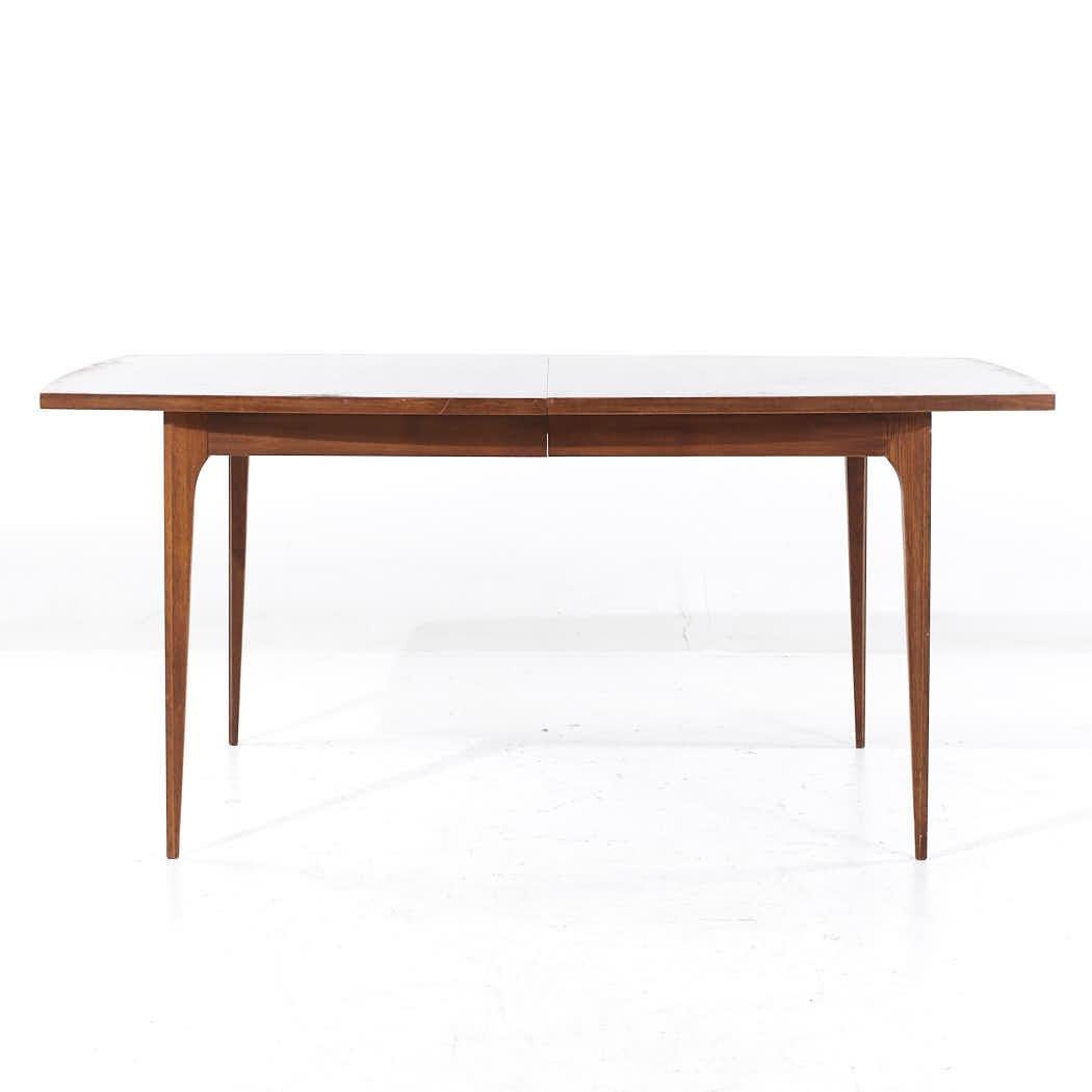 Broyhill Brasilia Mid Century Walnut Expanding Dining Table with 3 Leaves

This table measures: 66 wide x 40 deep x 30 inches high, with a chair clearance of 25.75 inches, each leaf measures 12 inches wide, making a maximum table width of 102 inches