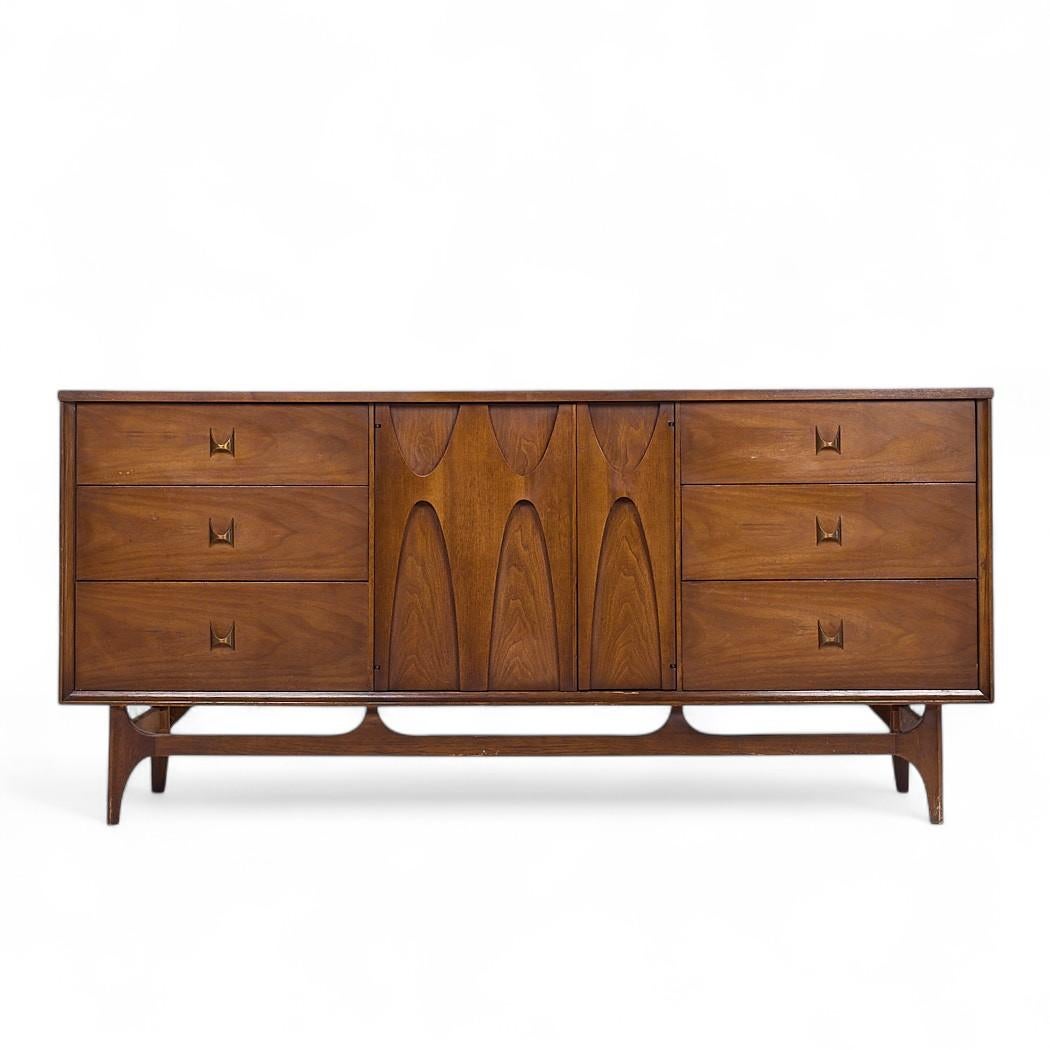 Broyhill Brasilia Mid Century Walnut Lowboy 9 Drawer Dresser

This lowboy measures: 66 wide x 19 deep x 31 inches high

All pieces of furniture can be had in what we call restored vintage condition. That means the piece is restored upon purchase so