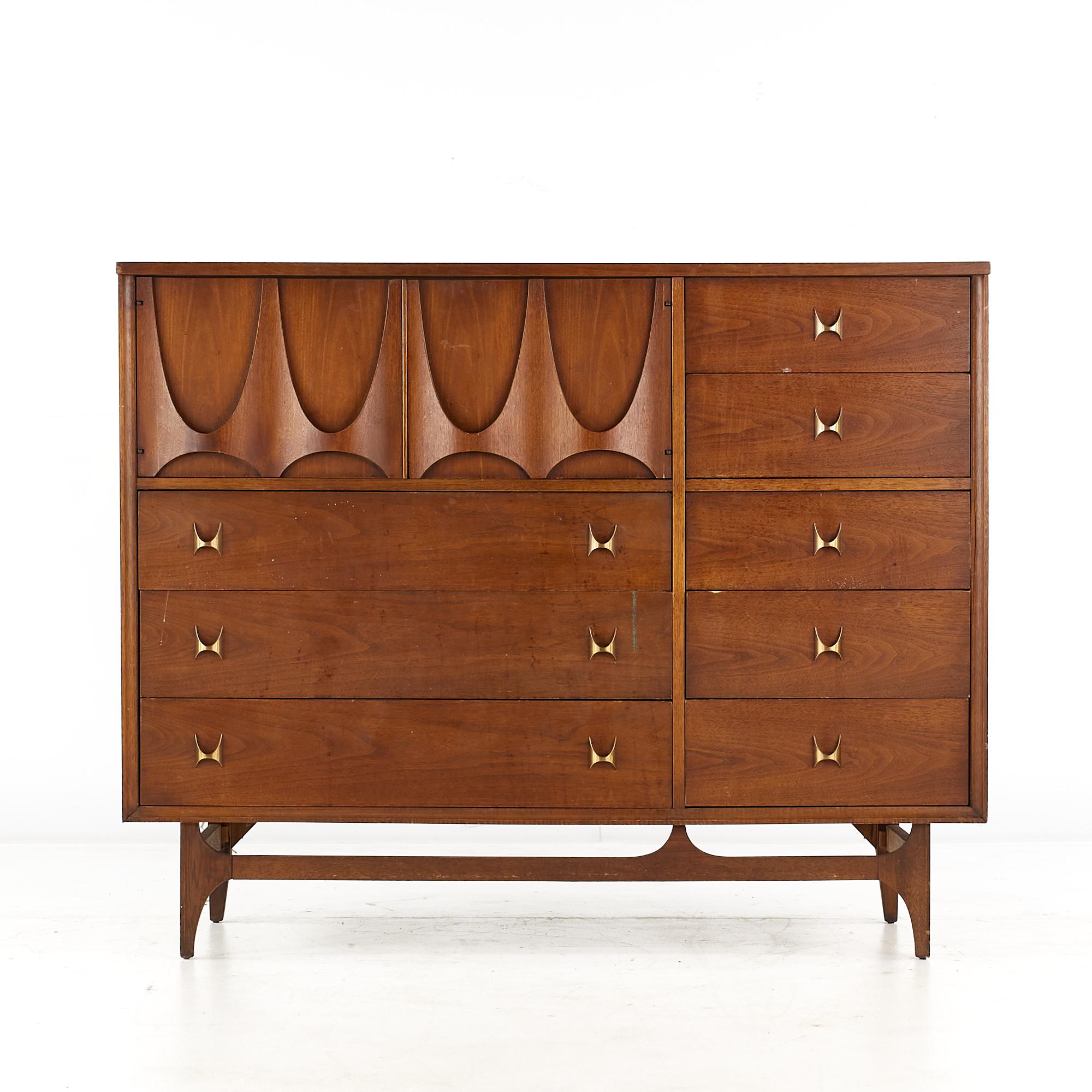 Broyhill Brasilia Mid Century Walnut Magna Dresser.

This dresser measures: 54 wide x 19 deep x 43.5 inches high.

All pieces of furniture can be had in what we call restored vintage condition. That means the piece is restored upon purchase so