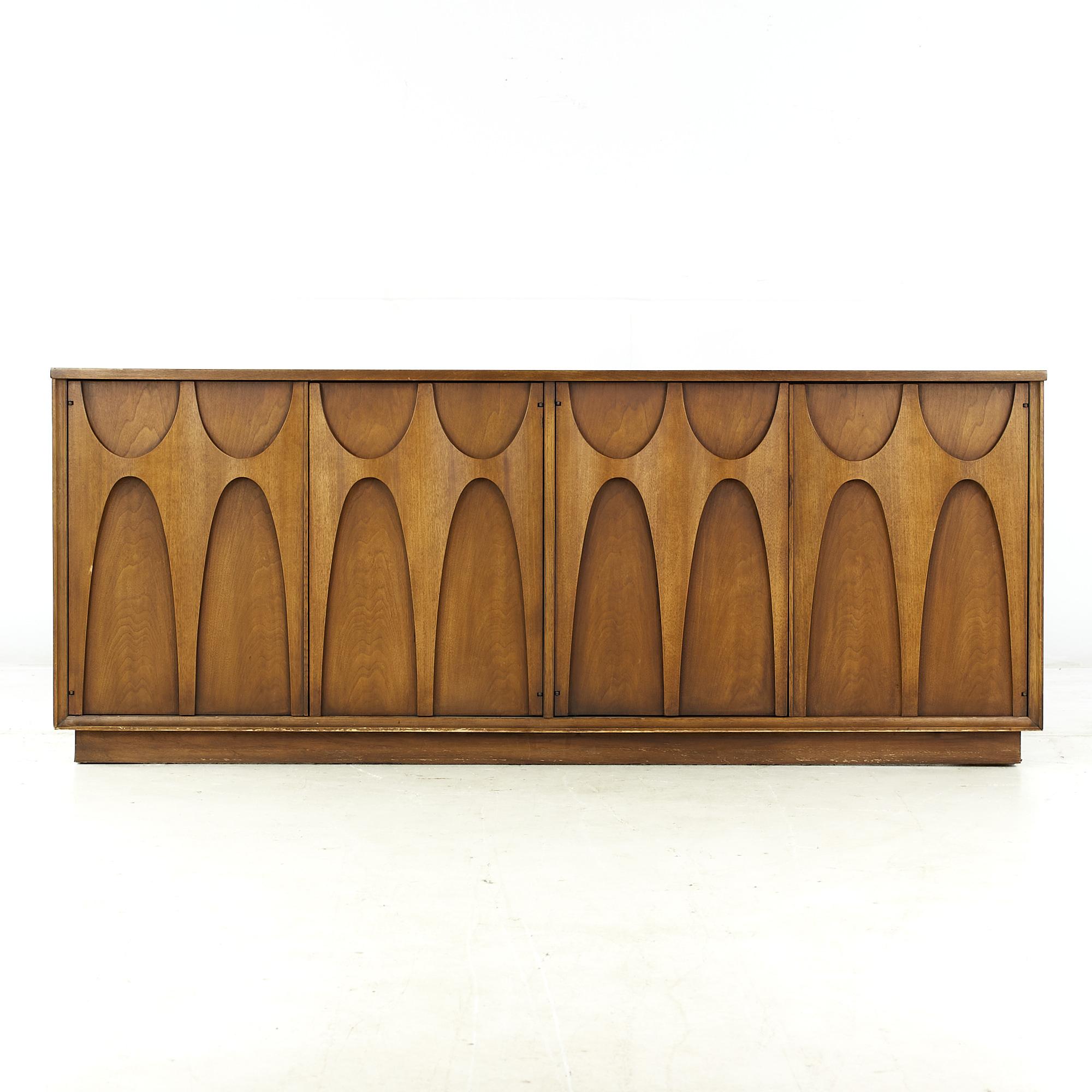 Broyhill Brasilia mid-century walnut plinth base credenza

This credenza measures: 72 wide x 19 deep x 29 inches high

All pieces of furniture can be had in what we call restored vintage condition. That means the piece is restored upon purchase
