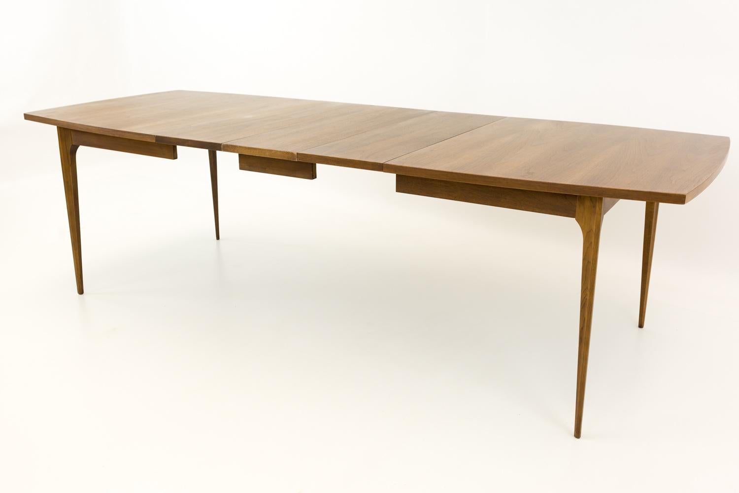 Broyhill Brasilia Mid Century 10 person rectangular dining table
Measures: 66.25 wide x 40.25 deep x 30 high. There are 3 leaves. Each leaf is 12 inches, allowing for a maximum table length of 102.25 inches.

All pieces of furniture can be had in