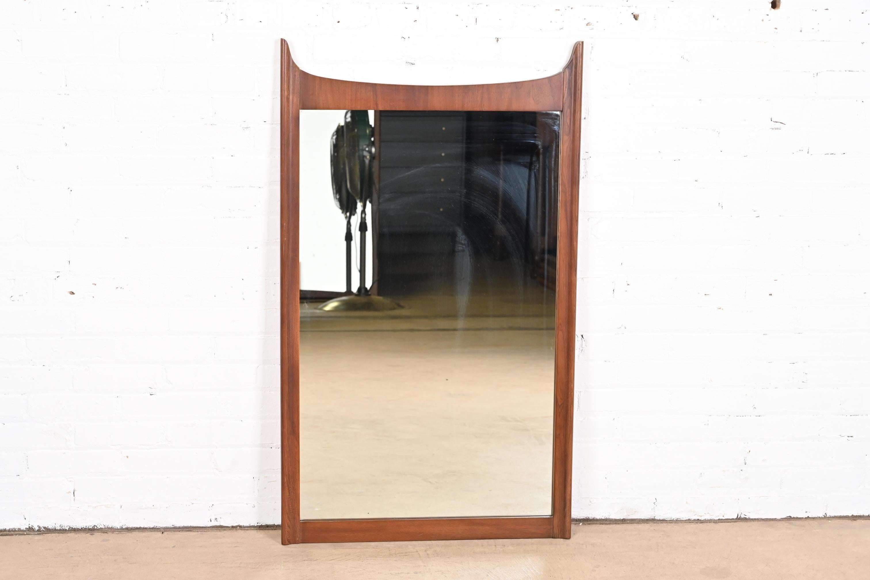 Broyhill Brasilia Style Mid-Century Modern Sculpted Walnut Framed Wall Mirror In Good Condition For Sale In South Bend, IN