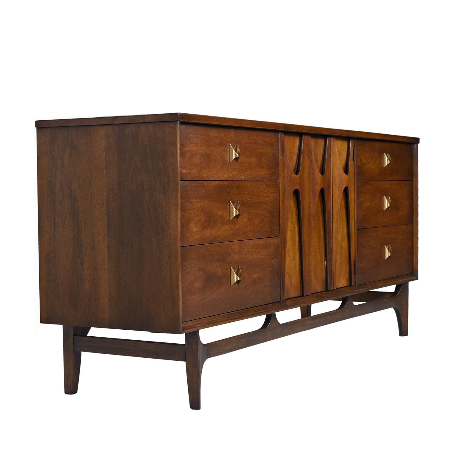 Part of a complete bedroom set, this triple dresser was delicately restored to preserve the original dark patina. We would find this dresser fairly often over the years, but Brasilia has elevated to a high-end status that has made them very sought