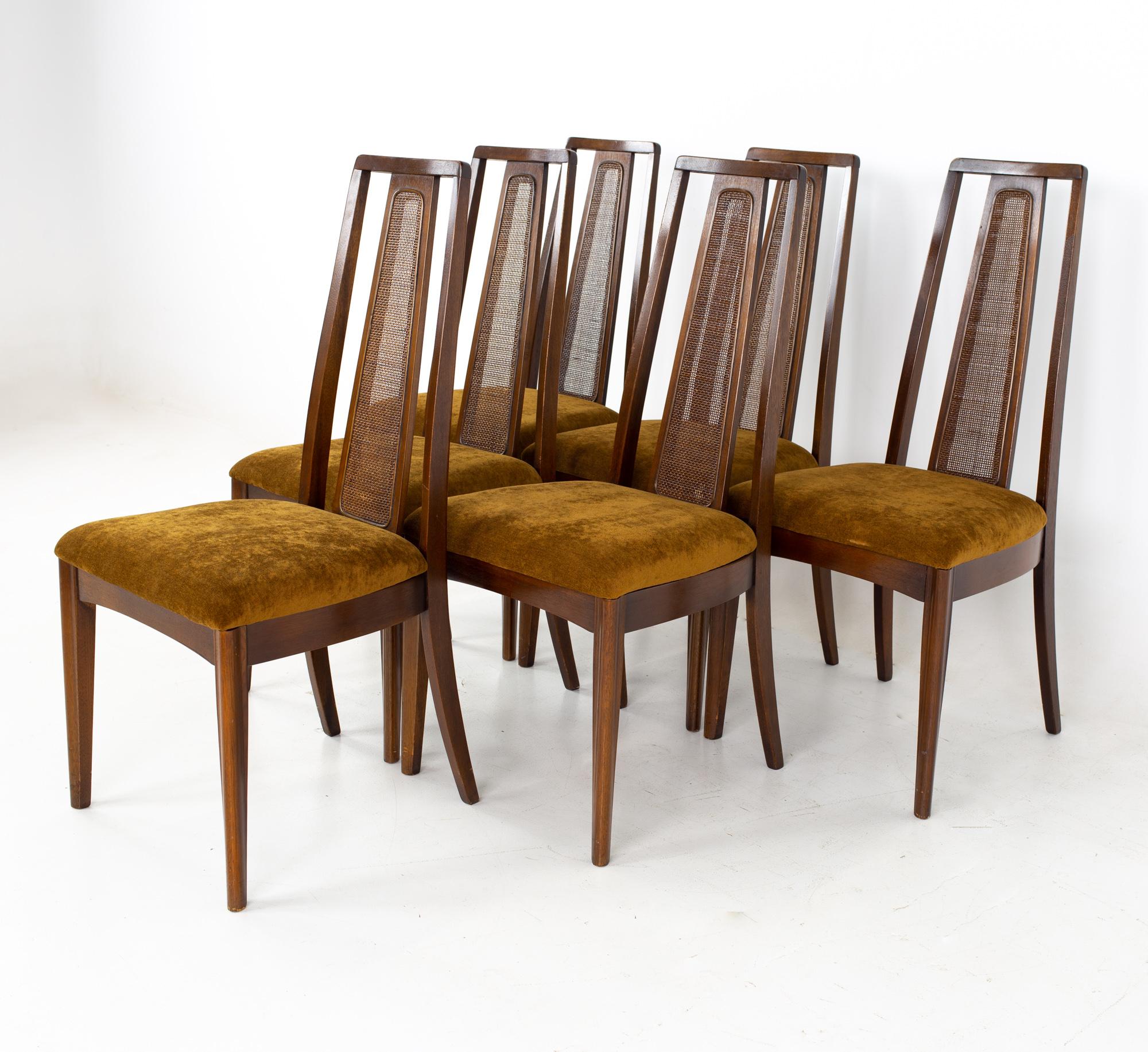 Broyhill emphasis mid century walnut and cane highback dining chairs - set of 6.
Each chair measures: 20 wide x 18 deep x 41.5 high, with a seat height of 18.5 inches

All pieces of furniture can be had in what we call restored vintage condition.