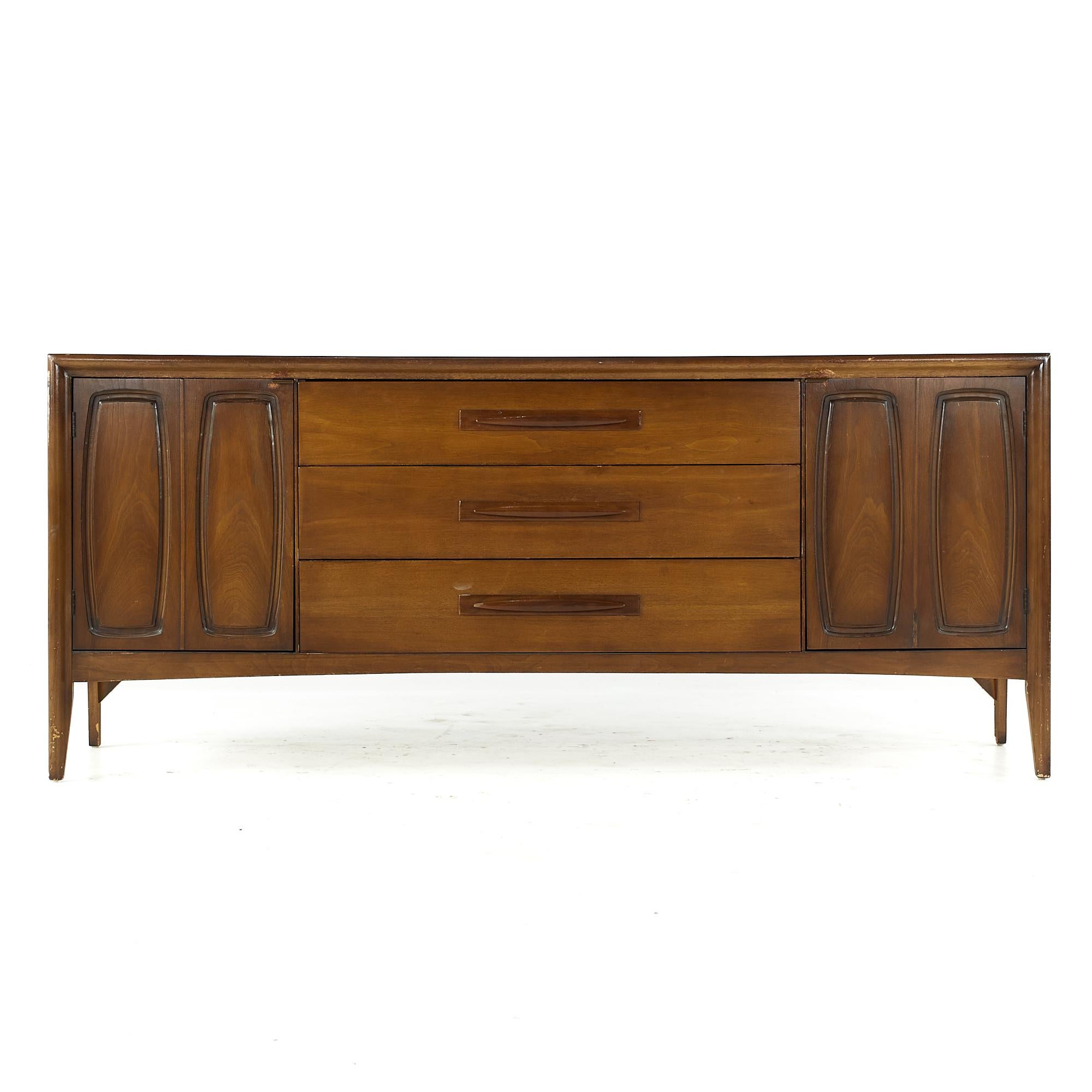Broyhill Emphasis midcentury walnut lowboy dresser

This lowboy measures: 72 wide x 19 deep x 31 inches high

All pieces of furniture can be had in what we call restored vintage condition. That means the piece is restored upon purchase so it’s