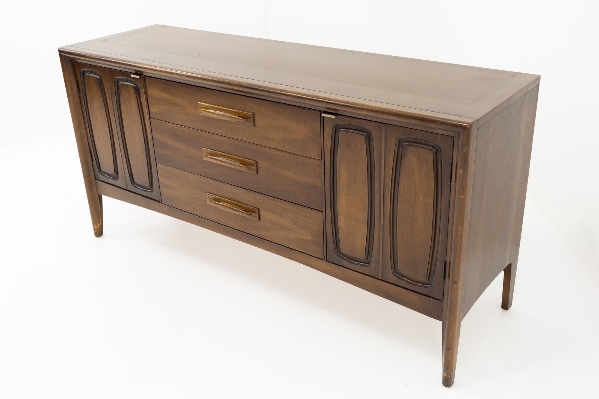 Broyhill Emphasis mid century walnut sideboard buffet credenza
This credenza measures: 56 wide x 17 deep x 27.75 inches high

All pieces of furniture can be had in what we call restored vintage condition. That means the piece is restored upon