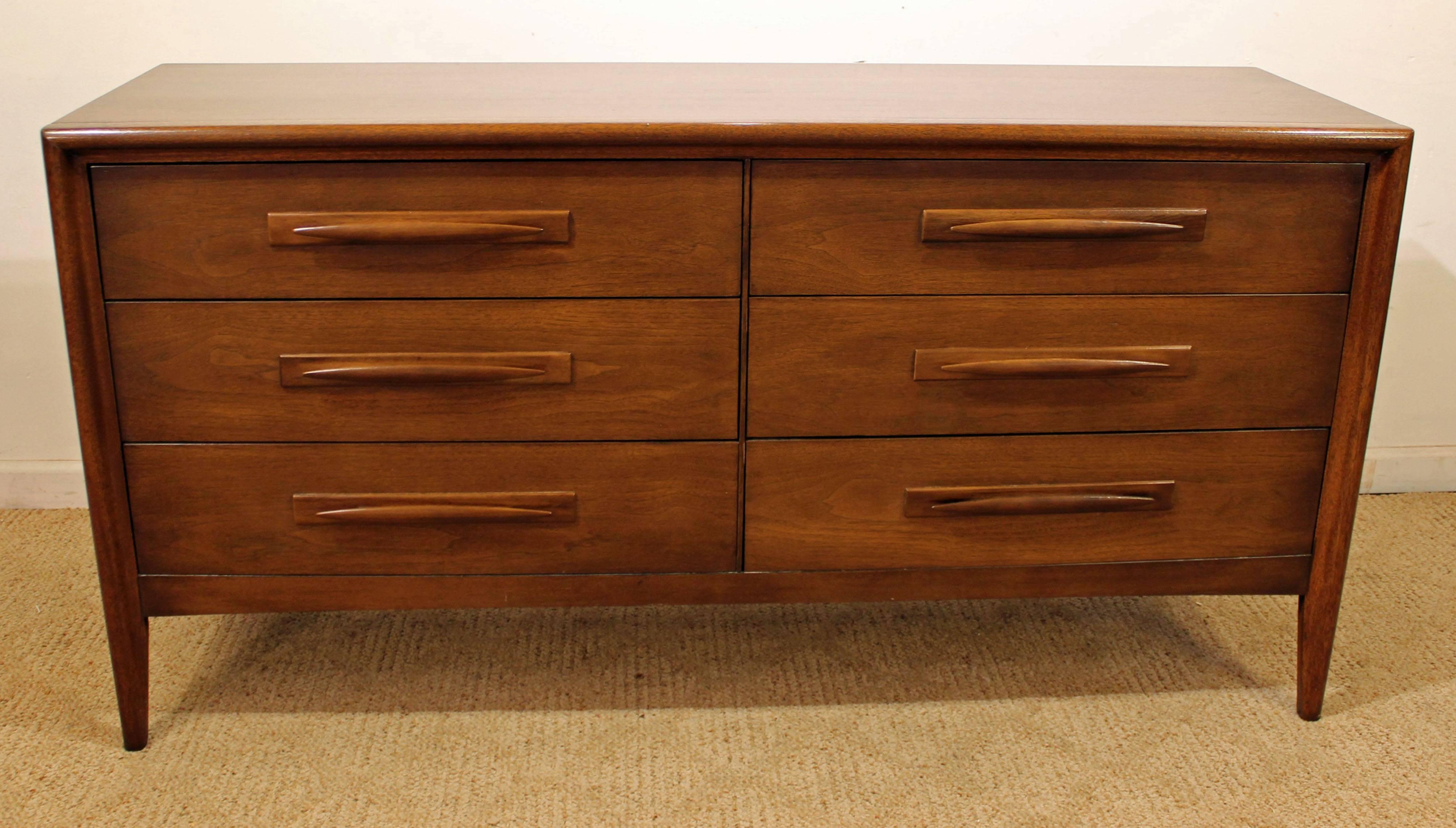 Offered is a walnut dresser by Broyhill 