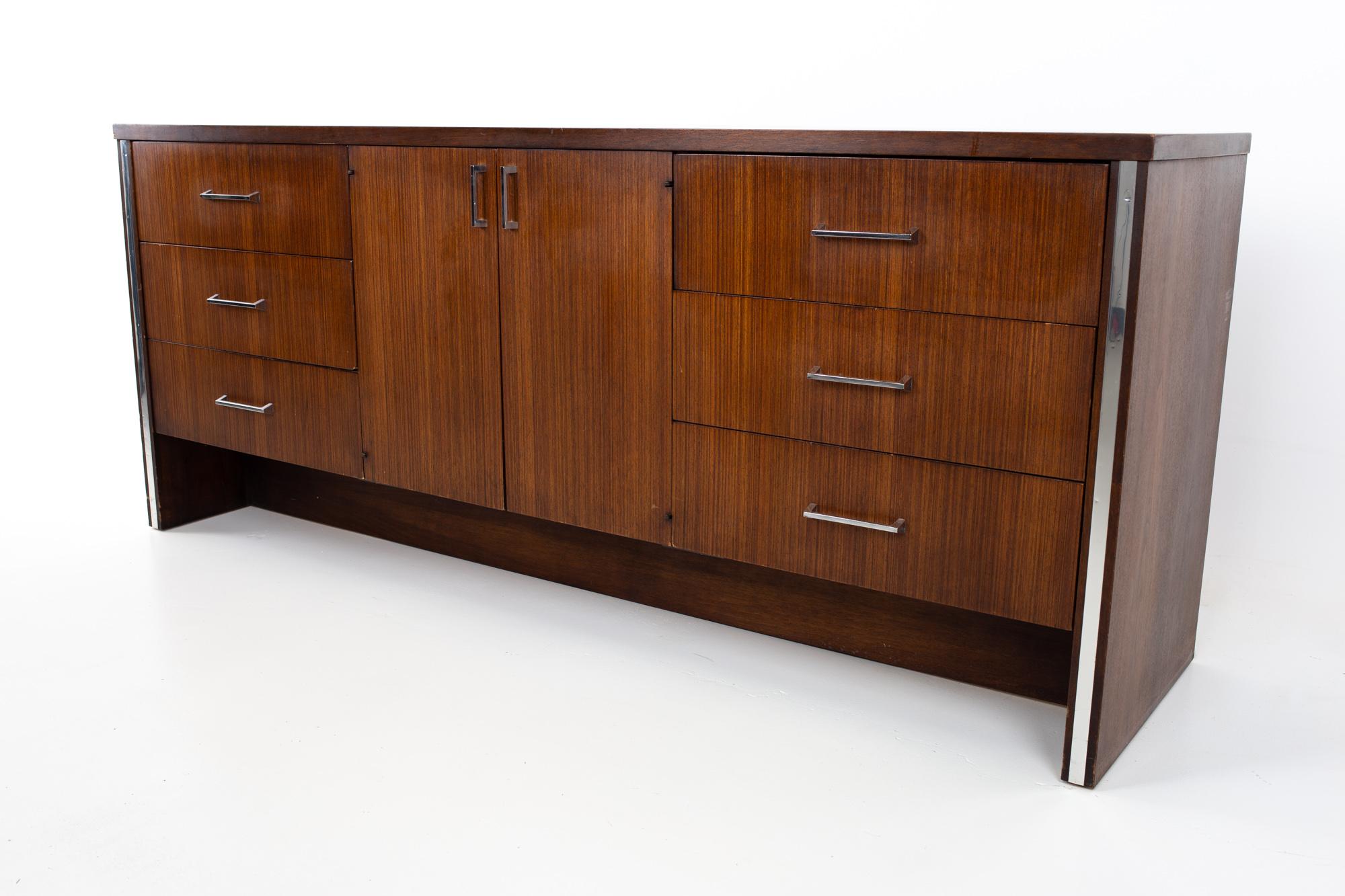 Broyhill premier mid century walnut and chrome 9 drawer lowboy dresser
Dresser measures: 71.75 wide x 19 deep x 30 inches high

All pieces of furniture can be had in what we call restored vintage condition. That means the piece is restored upon