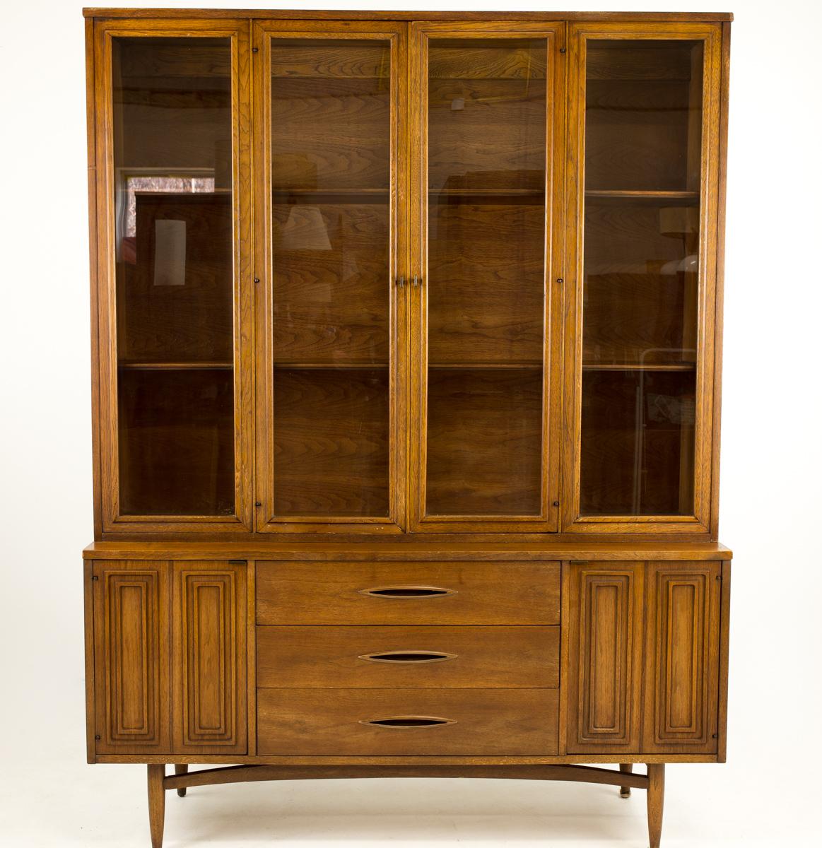Broyhill Premier Sculptra Mid Century China Cabinet

This cabinet measures: 58 wide x 17 deep x 77 inches high

All pieces of furniture can be had in what we call restored vintage condition. That means the piece is restored upon purchase so it’s