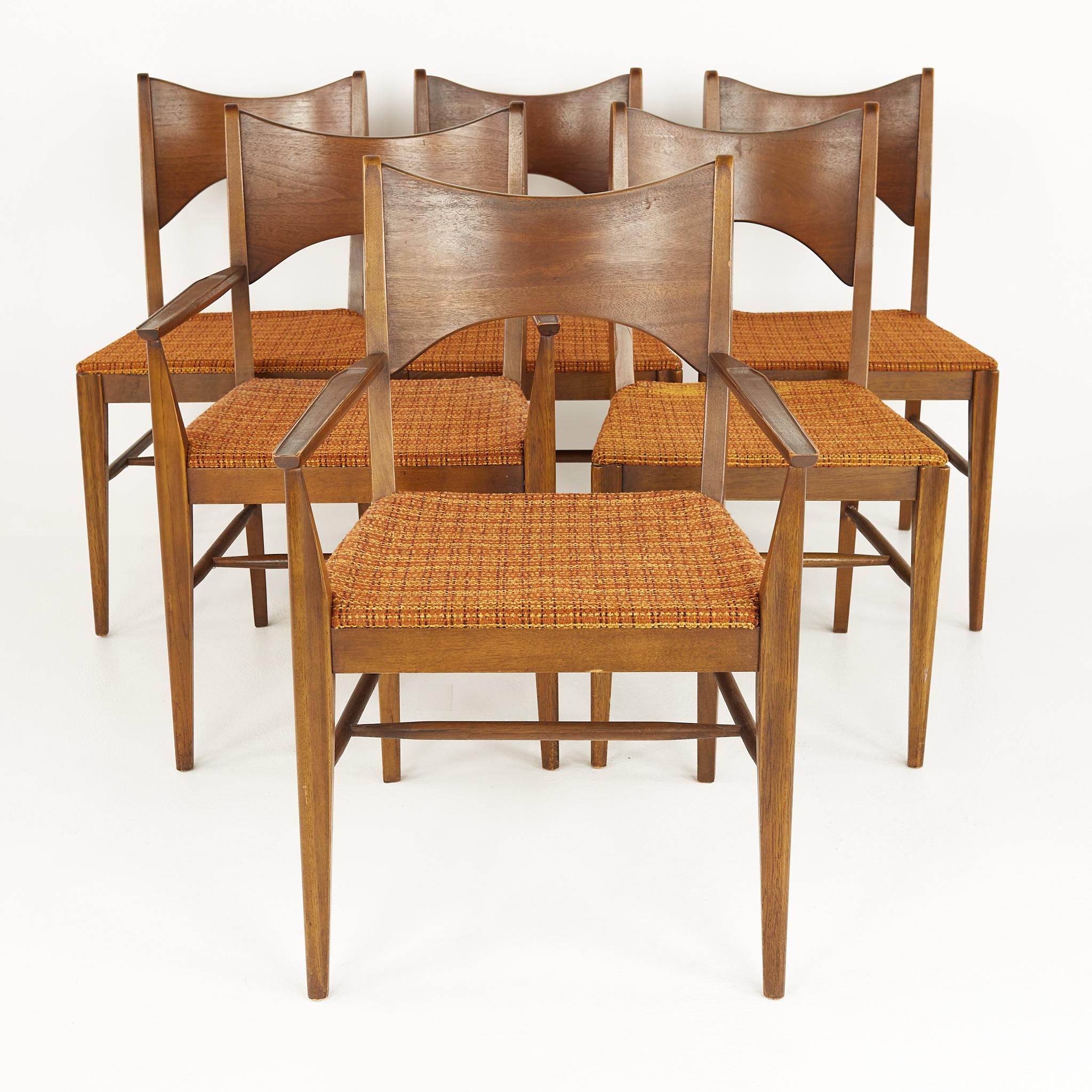 Broyhill saga mid century walnut dining chairs - set of 6

These chairs measure: 22 wide x 23.25 deep x 34 inches high, with a seat height of 18 and arm height of 25.25 inches

?All pieces of furniture can be had in what we call restored vintage