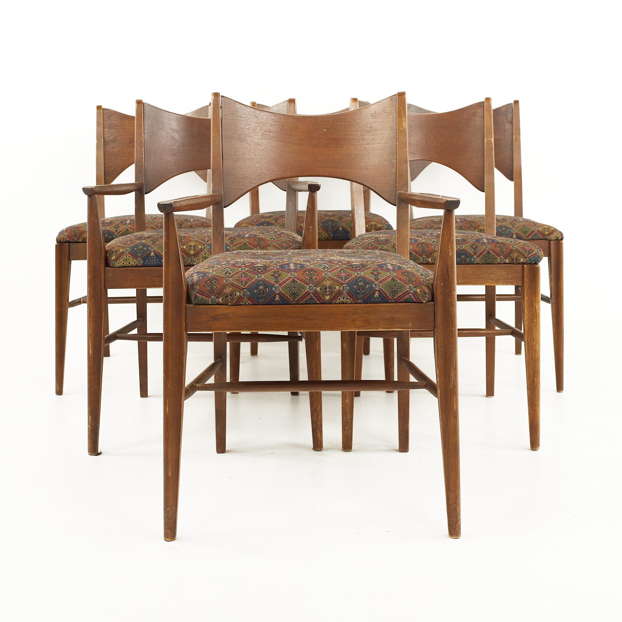 Broyhill Saga mid-icentury walnut dining chairs - set of 6

The captain's chair measures: 22.5 wide x 21 deep x 24 high, with a seat height of 21 inches and arm height of 25.5 inches
The side chairs measure: 19.5 wide x 21 deep x 24 high, with a