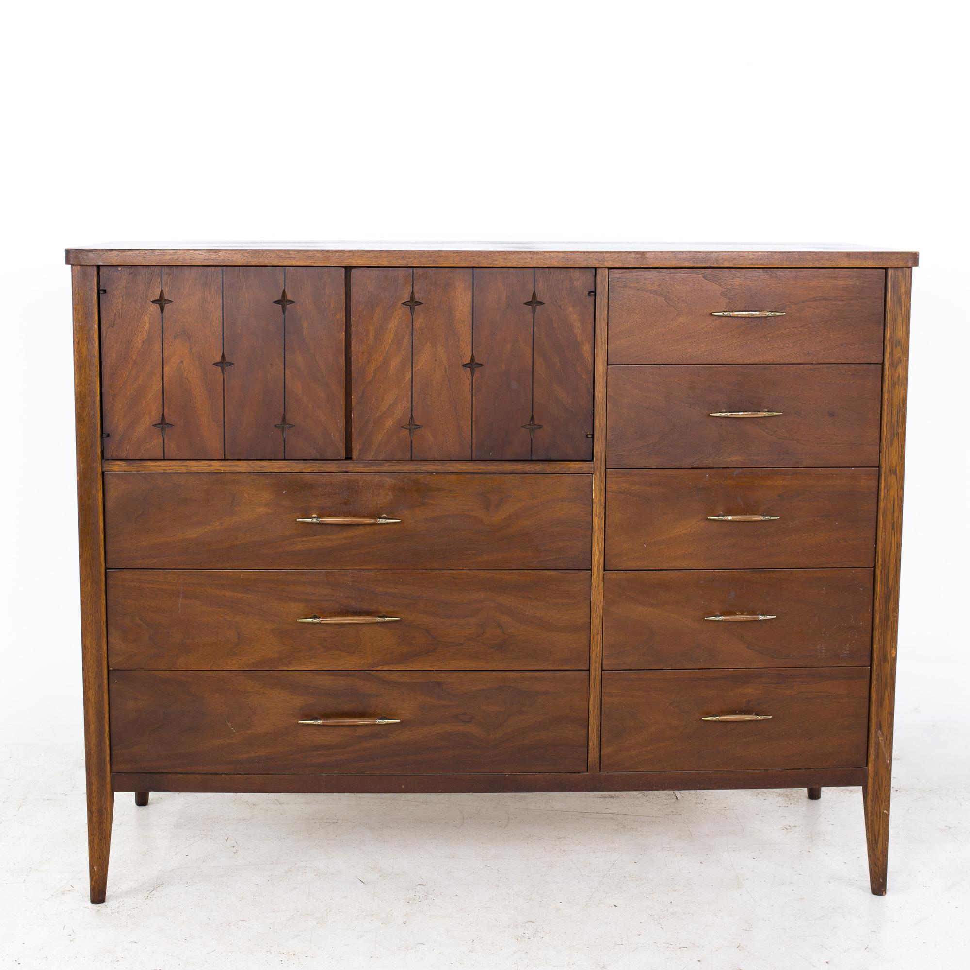 Broyhill Saga Mid Century Walnut Magna Highboy Dresser
Dresser measures: 54.75 wide x 19.25 deep x 43.75 inches high

All pieces of furniture can be had in what we call restored vintage condition. That means the piece is restored upon purchase so