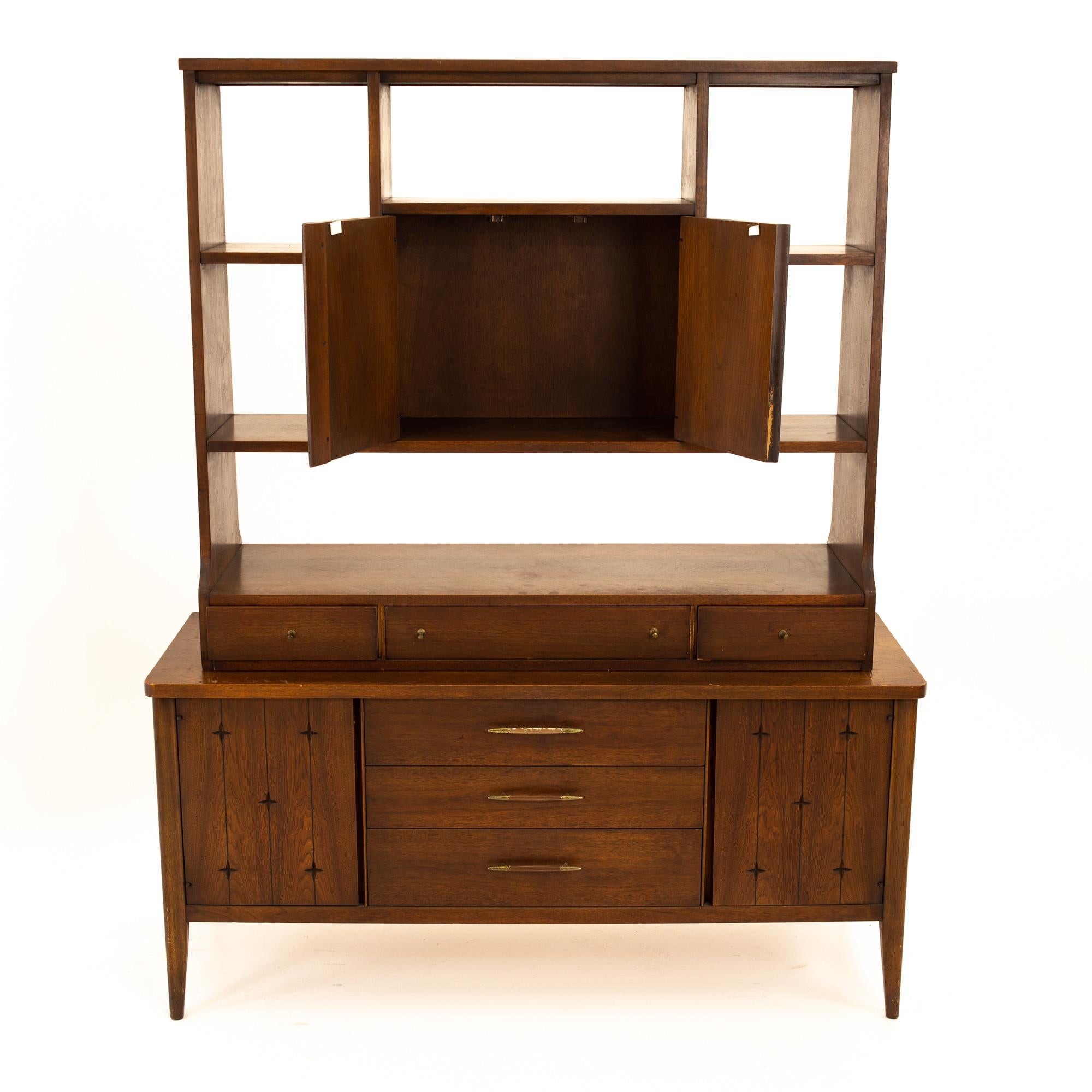 Broyhill saga midcentury walnut room divider
Room divider measures: 54.75 wide x 18.5 deep x 94.25 high

All pieces of furniture can be had in what we call restored vintage condition. That means the piece is restored upon purchase so it’s free of