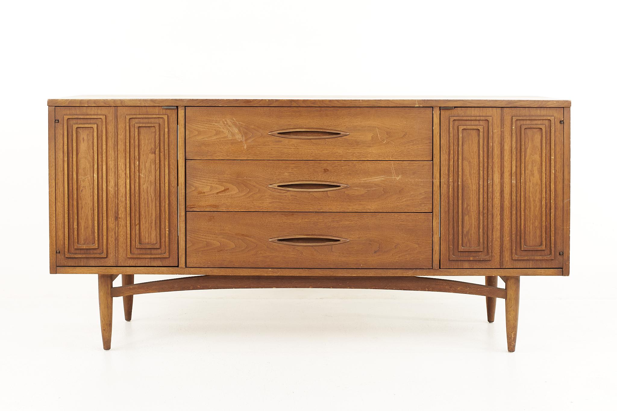 Broyhill sculptra Brutalist mid century walnut credenza

The credenza measures: 62.25 wide x 17 deep x 32.25 inches high

All pieces of furniture can be had in what we call restored vintage condition. That means the piece is restored upon