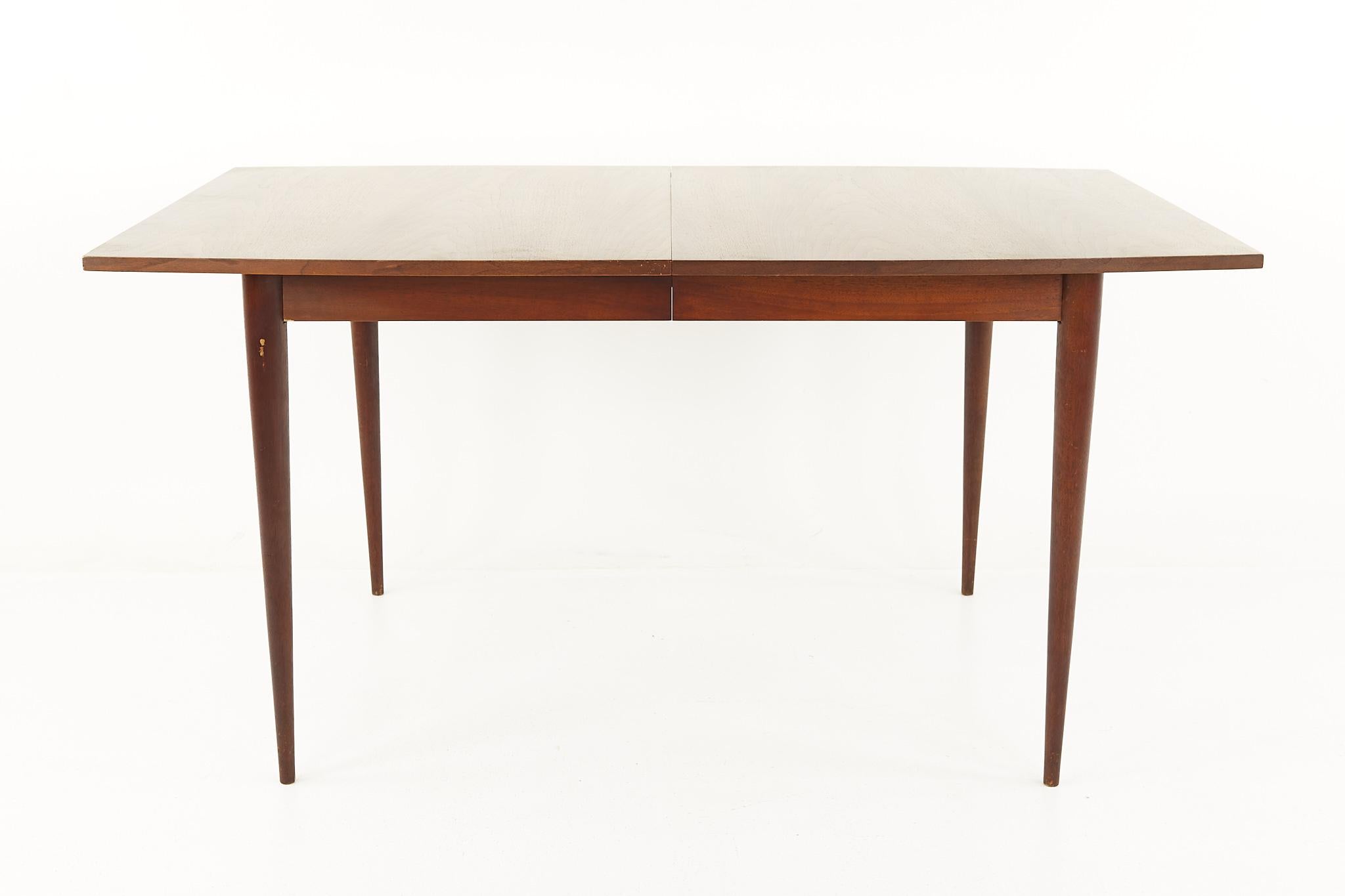 Broyhill Sculptra Mid Century Walnut Dining Table with 3 Leaves

This table measures: 60 wide x 40 deep x 29.75 inches high, with a chair clearance of 26.75 inches, each of the 3 leaves measure 12 inches wide, making a maximum table width of 96