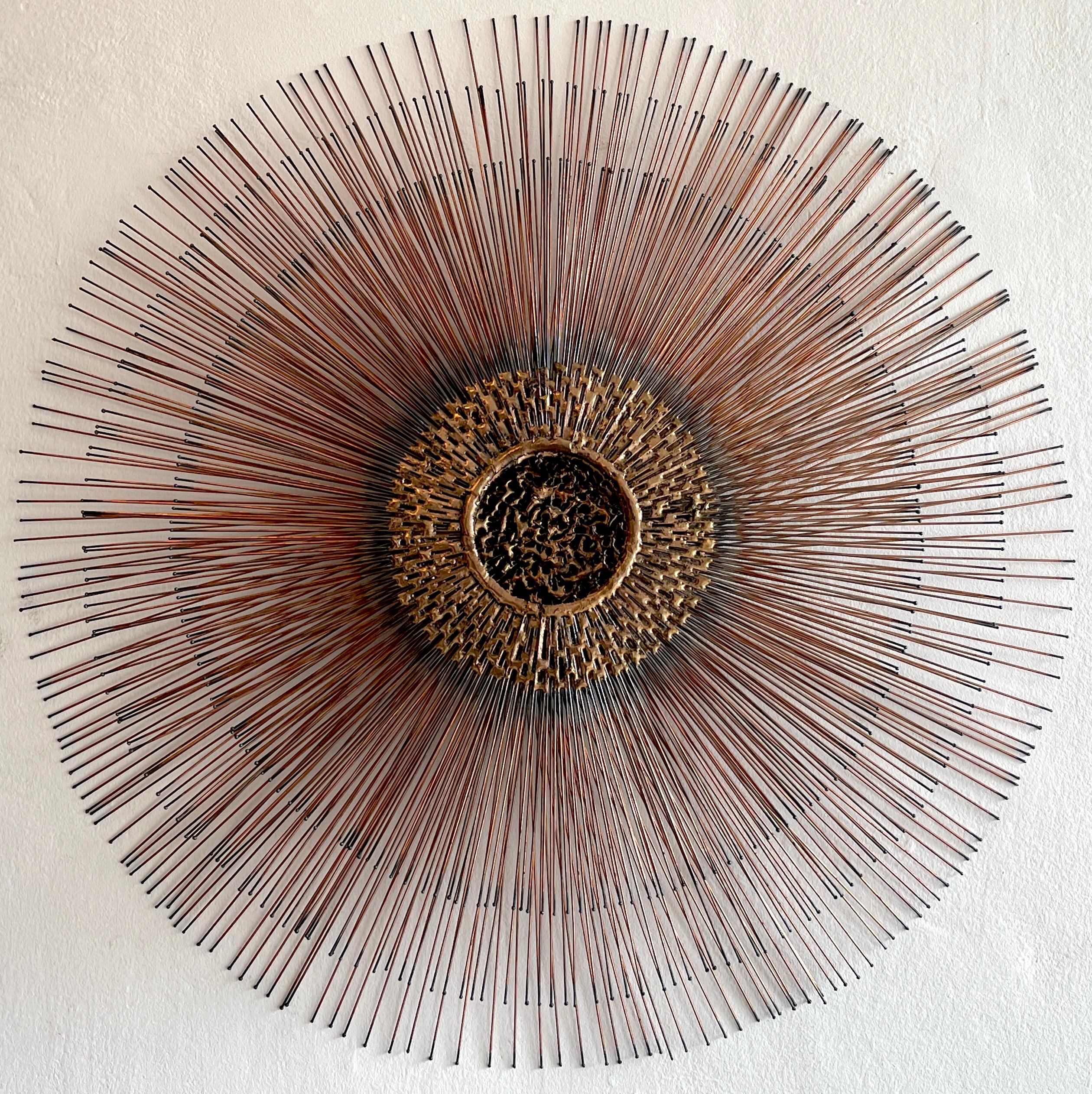Bruce and William Friedle metal five-tier sunburst, of typical form with hundreds of long, thin copper rods with blackened tips resembling burnt matchsticks radiate with molten 4