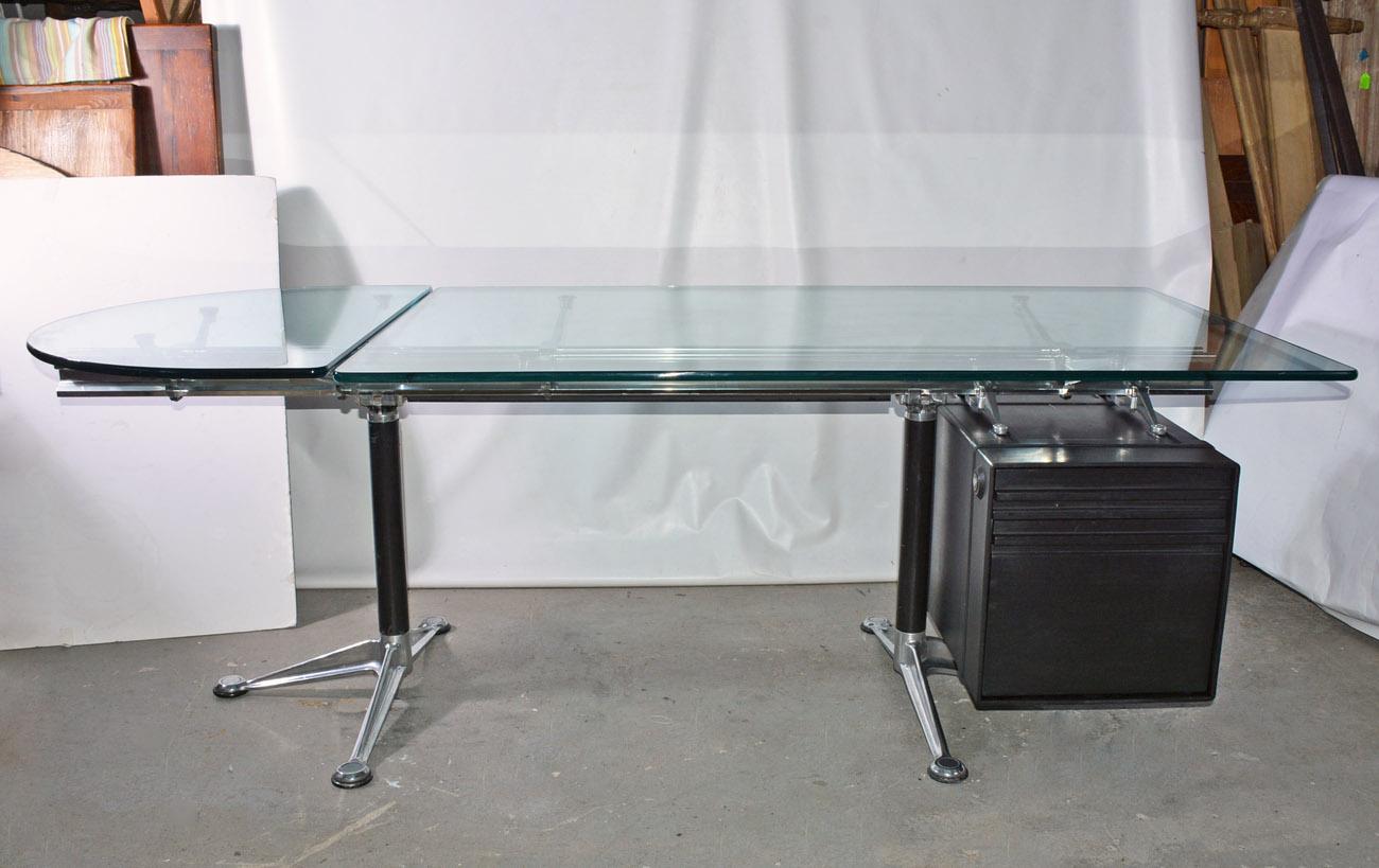 Bruce Burdick executive desk for Herman Miller features aluminium frame base and file drawers. Desk is topped by long rectangular piece and a separate rounded edge piece. Component include top drawer and a lower drawer unit for filing. The key for