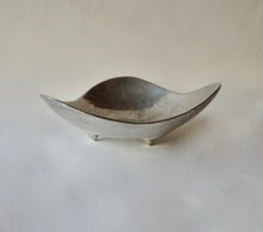 Bruce Fox organic form polished cast aluminum footed bowl .