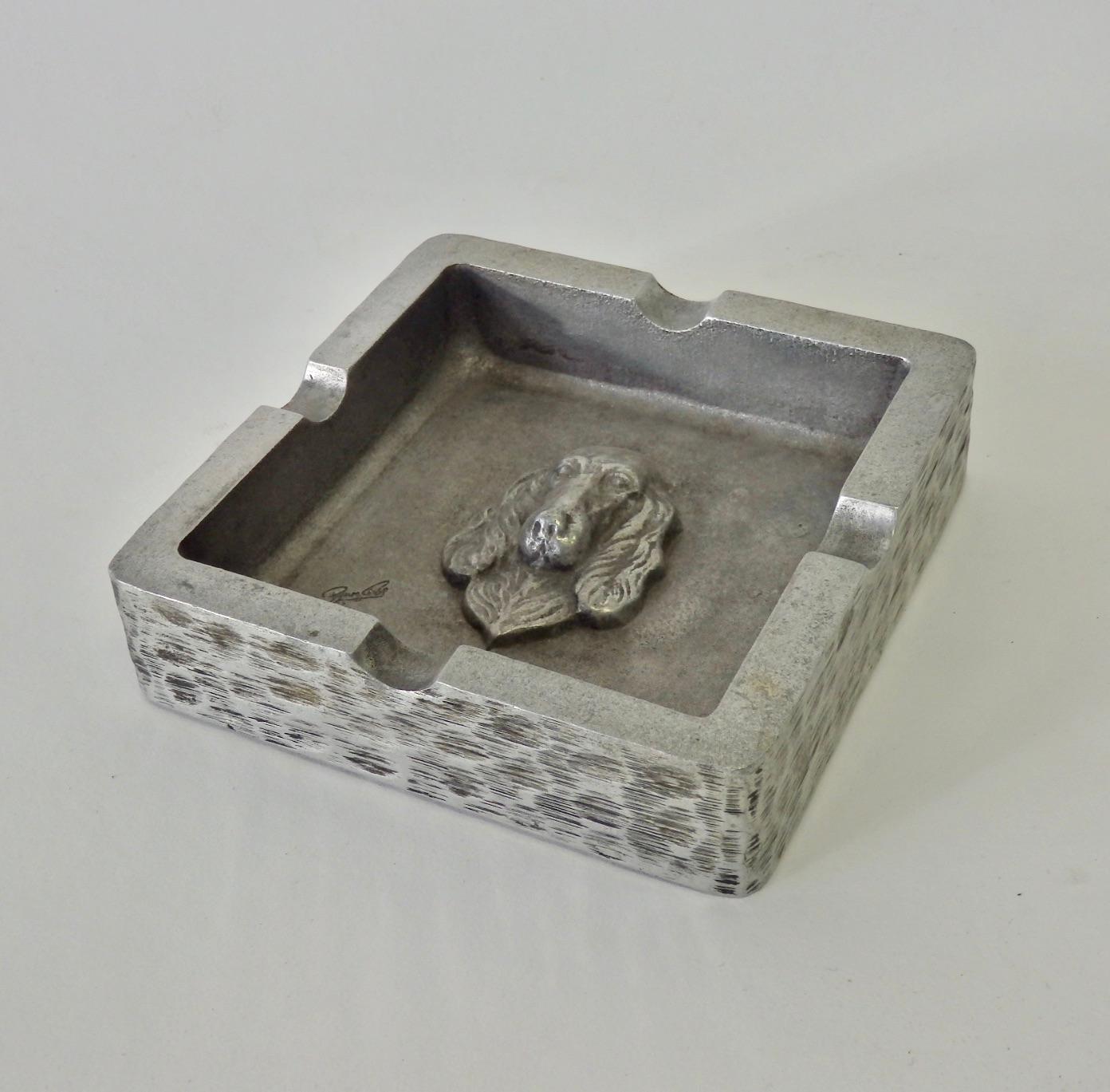 Handcrafted Bruce Fox cast aluminum ash tray. Setter dog decoration cast into center.