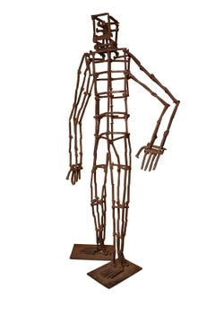 Escultura monumental del hombre de la traviesa de hierro de Bruce Gray