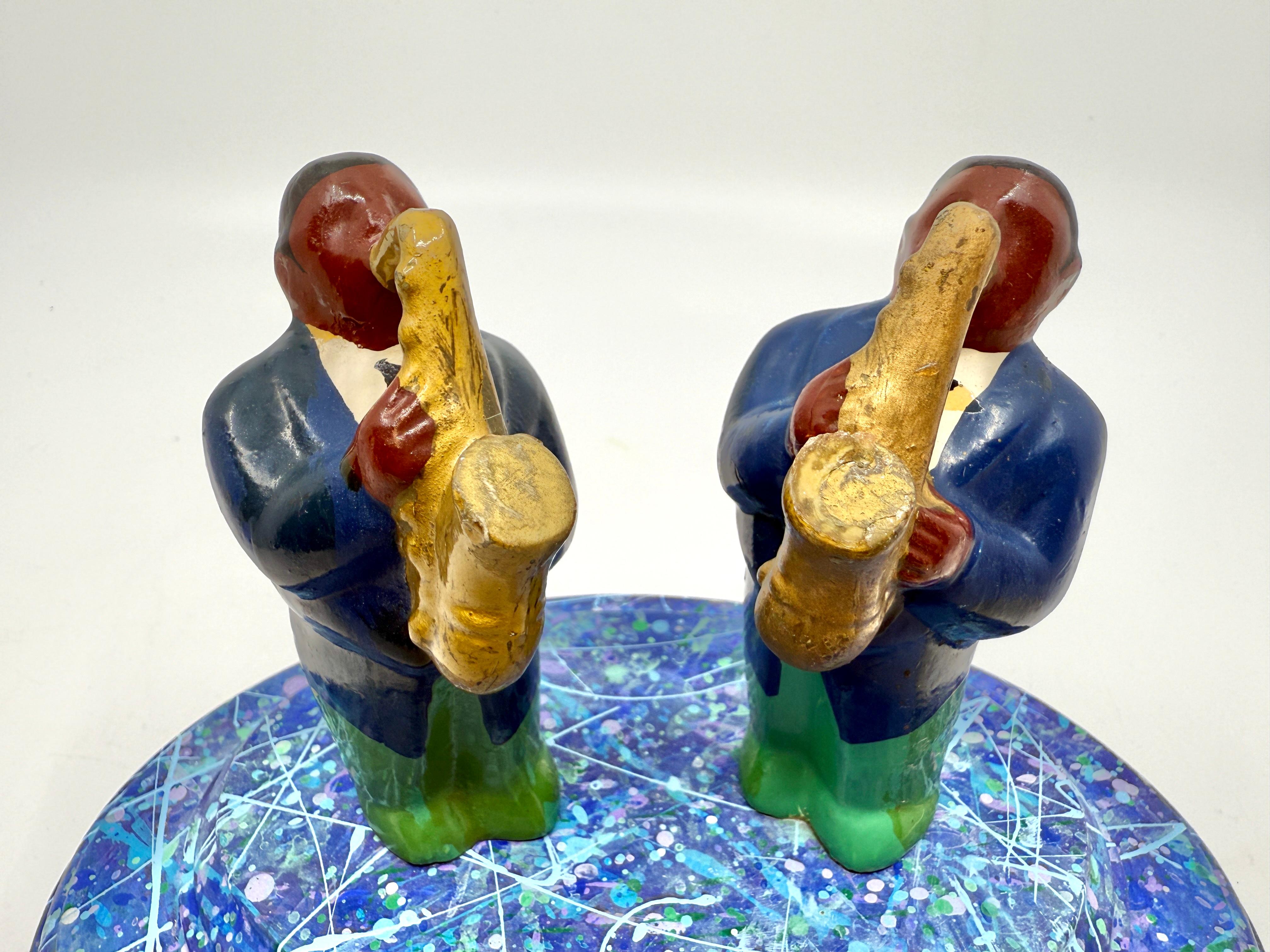 A wonderful miniature by the noted California Artist Bruce Houston. It is signed and dated on the bottom 1997. It depicts two Saxophones musicians. Beautifully detailed and painted. 
The miniature sculpture is in good condition with some minor marks