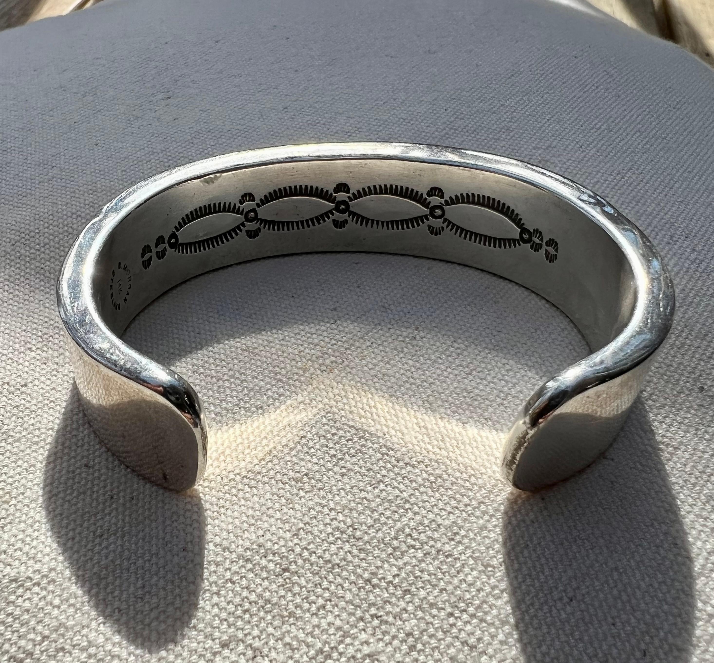 Sterling Silver and 14 Karat Yellow Bruce Morgan cuff bracelet (stamped B. Morgan, 14K, Sterling) set with three Old Mine Cut diamonds, approximately 1.15 carat total weight with matching M/N/O color and SI2-I1 clarity.  The bracelet measures 17.5mm