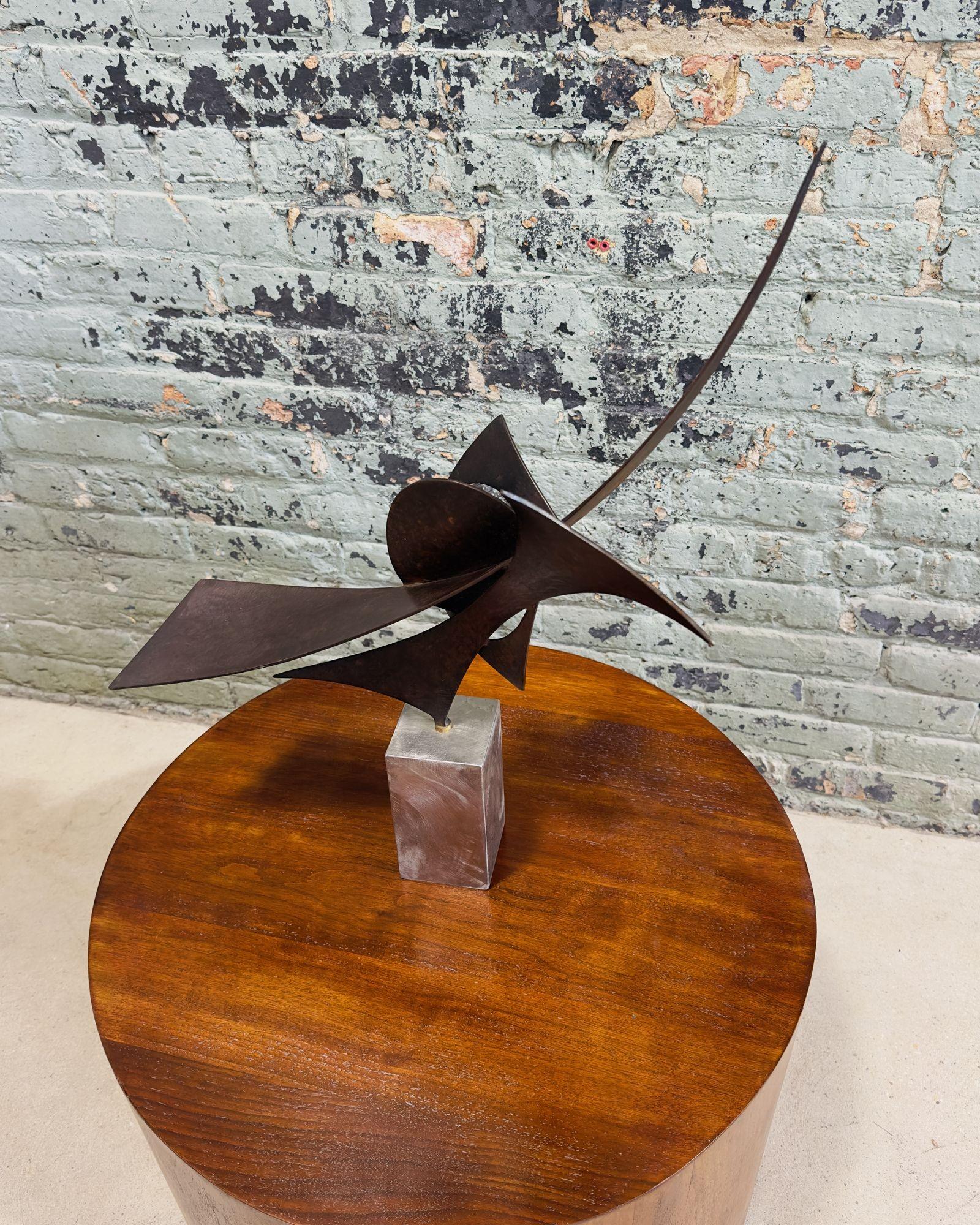 Bruce Niemi Bronze Sculpture Signed, 2003. Base is made out of brushed steel.