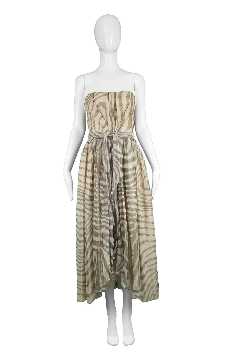 Bruce Oldfield Vintage 1980s Cream Silk Chiffon Striped Strapless Party Dress

Estimated Size: UK 6-8/ US 2-4/ EU 34-36. Please check measurements.
Bust - 32” / 81cm
Waist - 24” / 61cm
Hips - Free
Length (Bust to Hem) - 42” / 106cm

Condition: Very