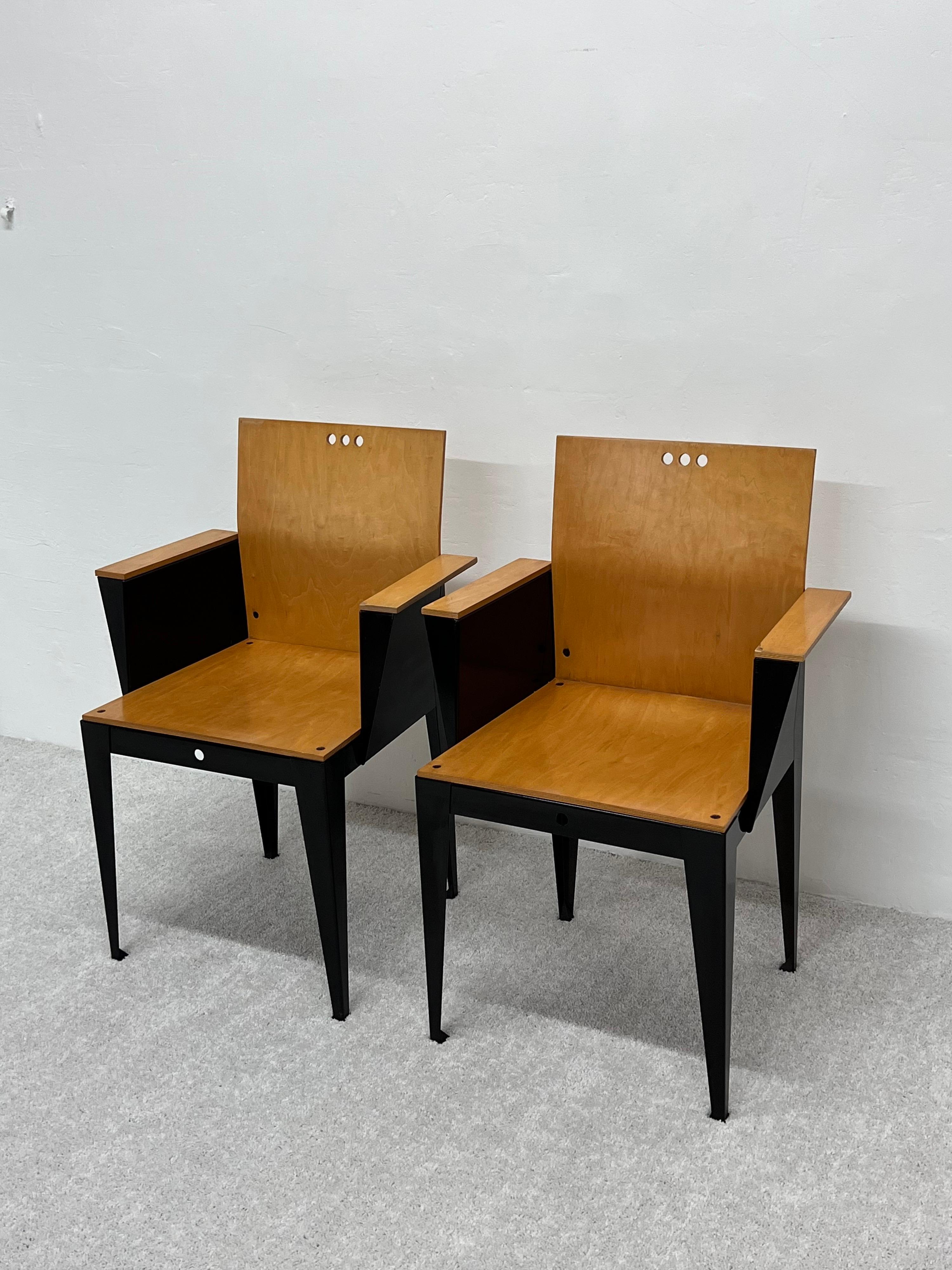 Rare pair of Eli armchairs with maple wood seat, back and arms attached to a black powder coated steel base. Designed by Bruce Sienkowski for Charlotte, 1991.

Measure: arm height: 26-1/4
