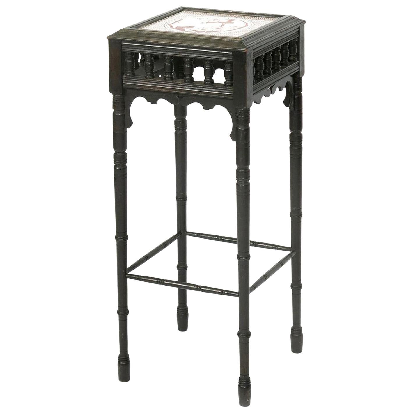 Bruce Talbert an Aesthetic Movement Ebonized Plant Stand with Inset Minton Tile