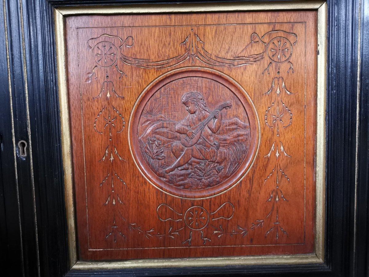 Aesthetic Movement Side Cabinet with Carved panels of Putti Putti playing music. For Sale 1
