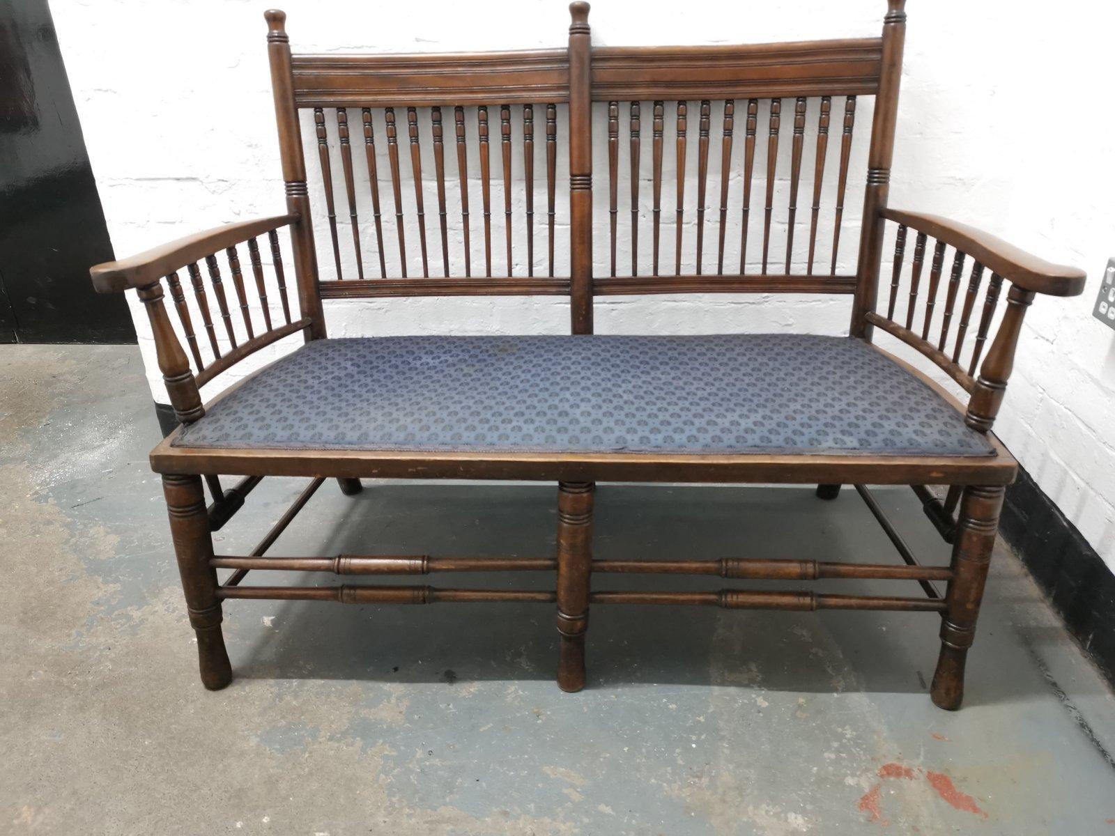 Bruce talbert attributed. In the William Morris Sussex style.
An Aesthetic Movement upholstered love or twin window seat. 
Made from stained Beech with turned and rounded finials and tramline details to the back headrests. With elongated turned