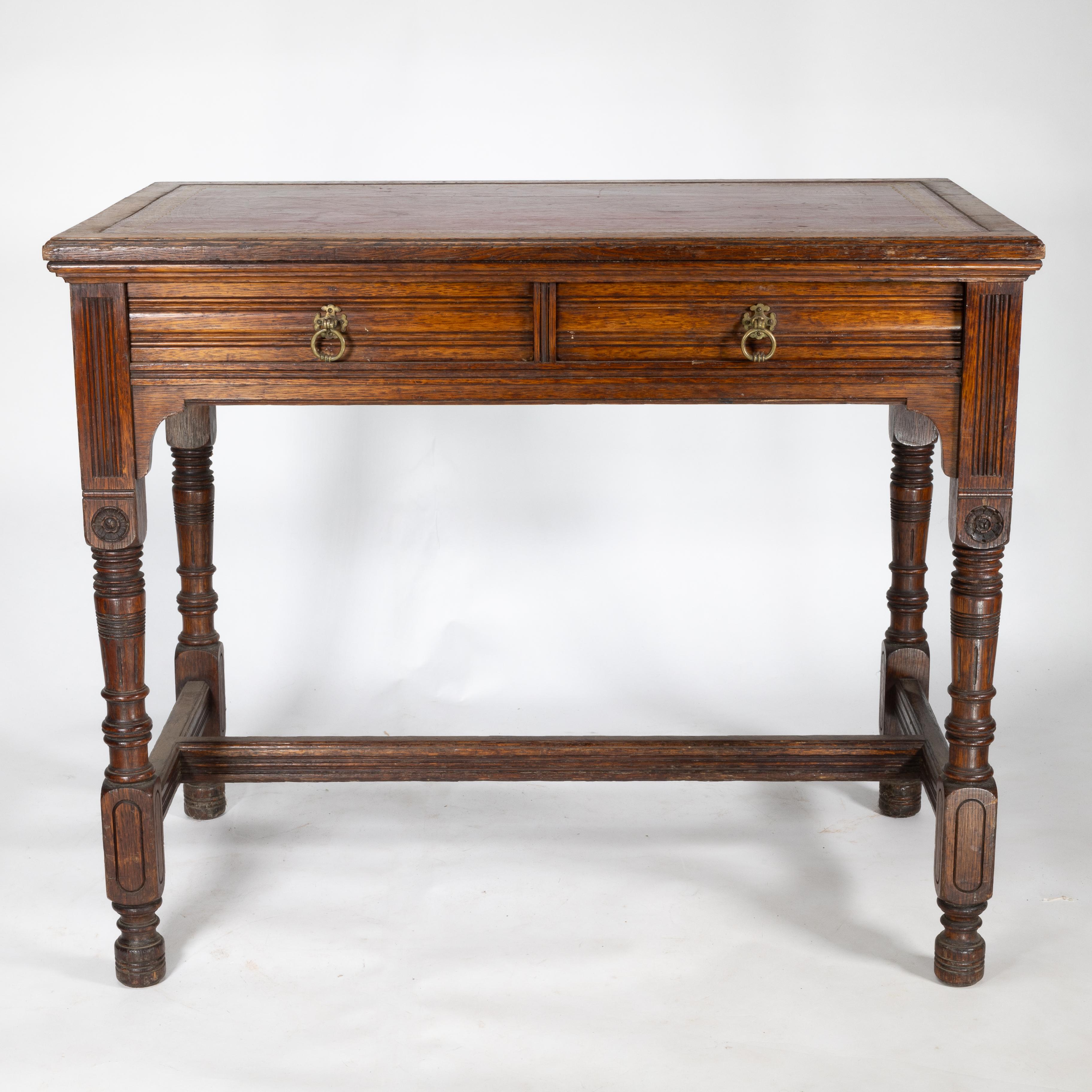 Bruce Talbert (1838-1881) for Gillow and Co., an oak two-drawer writing table, with a later red leather top, stamped mark, no. L9534.