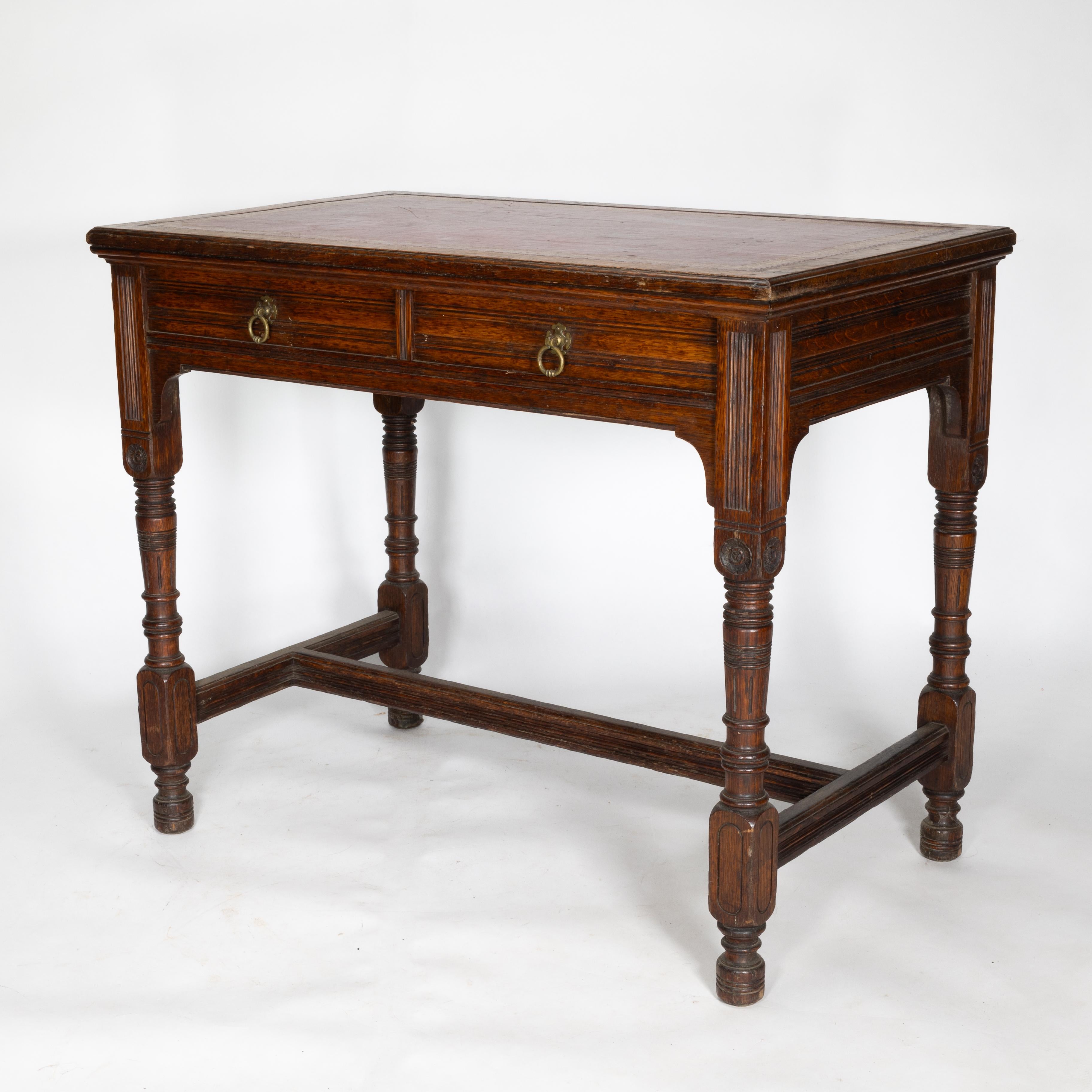 English Bruce Talbert for Gillow and Co. A Gothic Revival Oak and Leather Writing Table For Sale