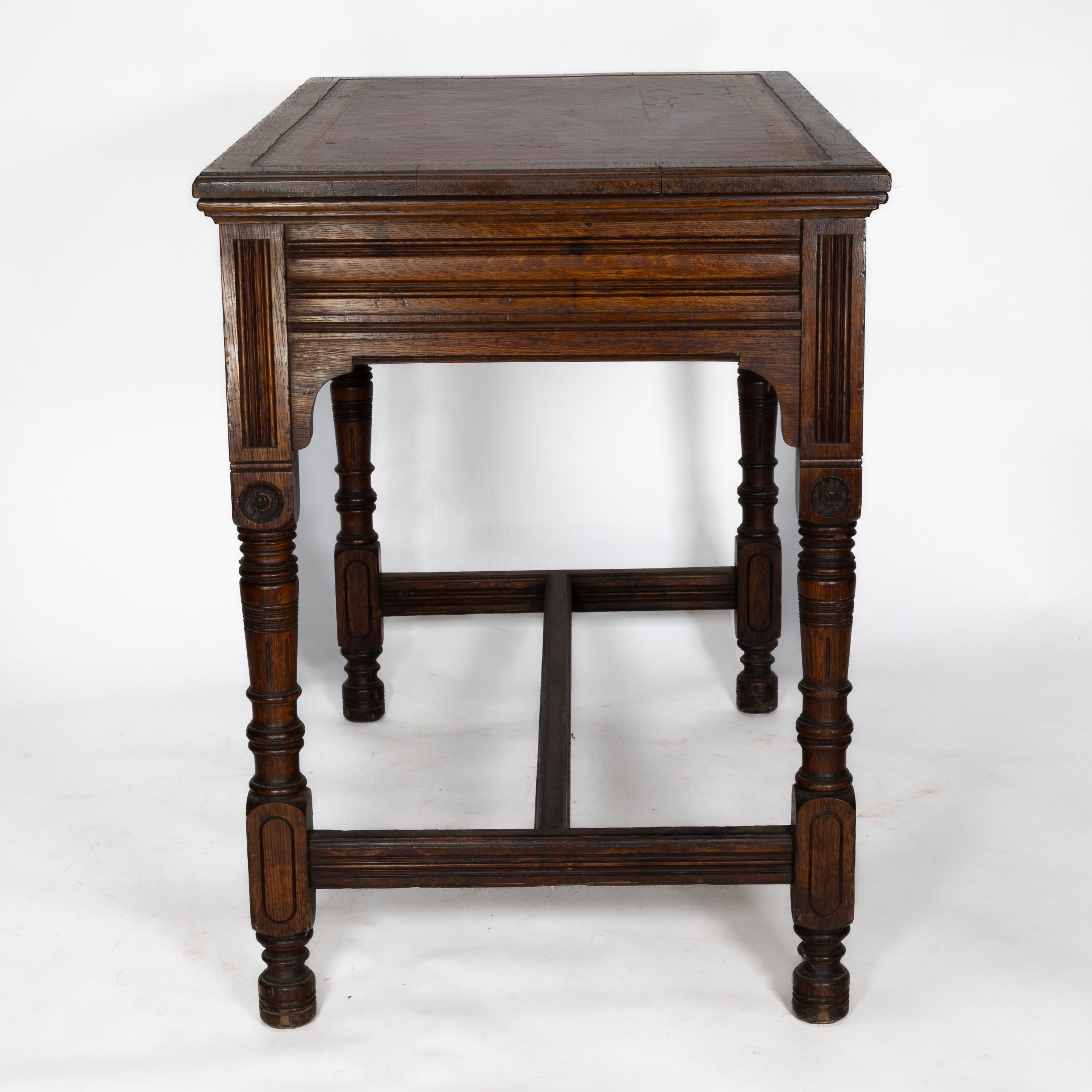 19th Century Bruce Talbert for Gillow and Co. A Gothic Revival Oak and Leather Writing Table For Sale