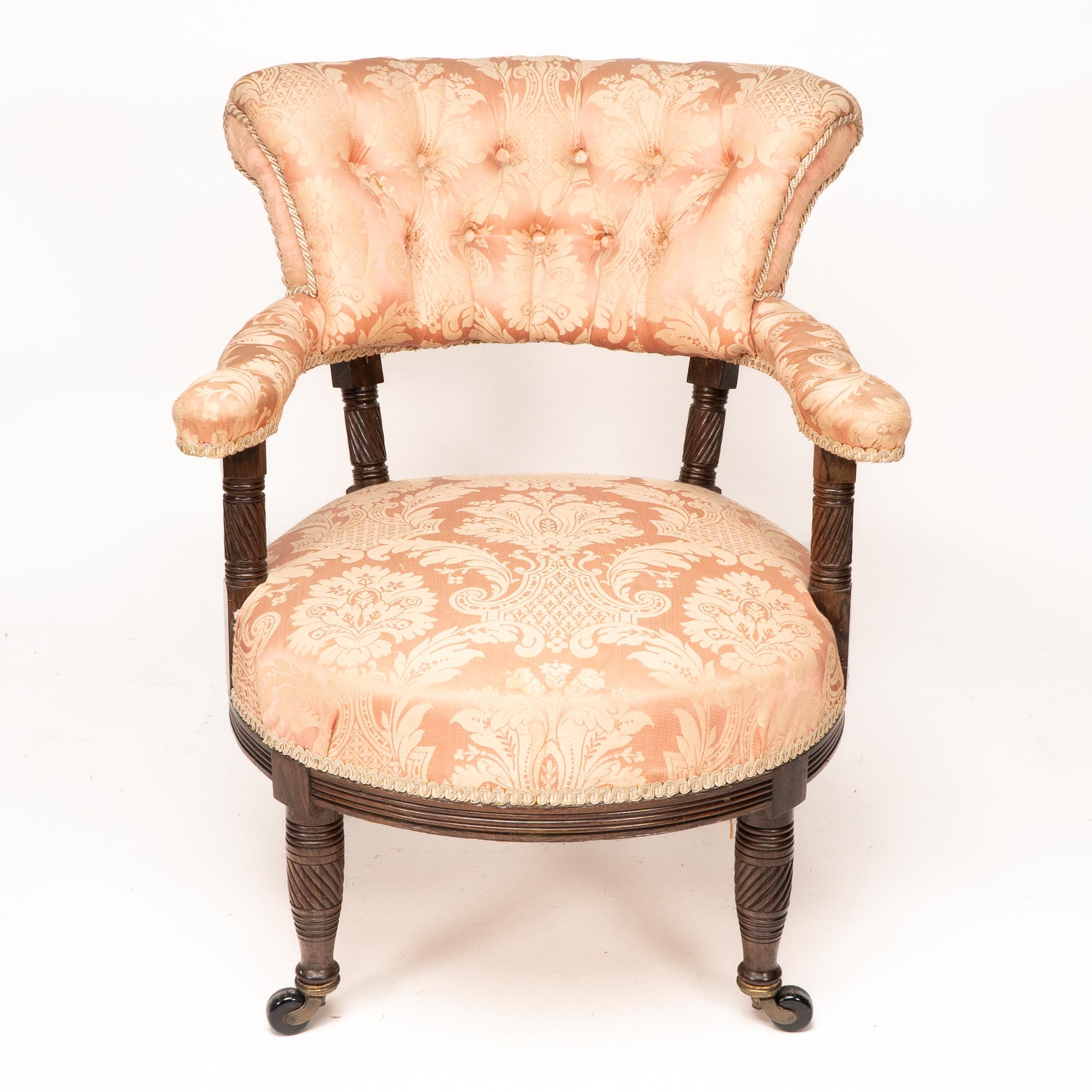 Bruce Talbert for Gillows. An Aesthetic Movement Rosewood armchair with a pink button back upholstered back and seat.