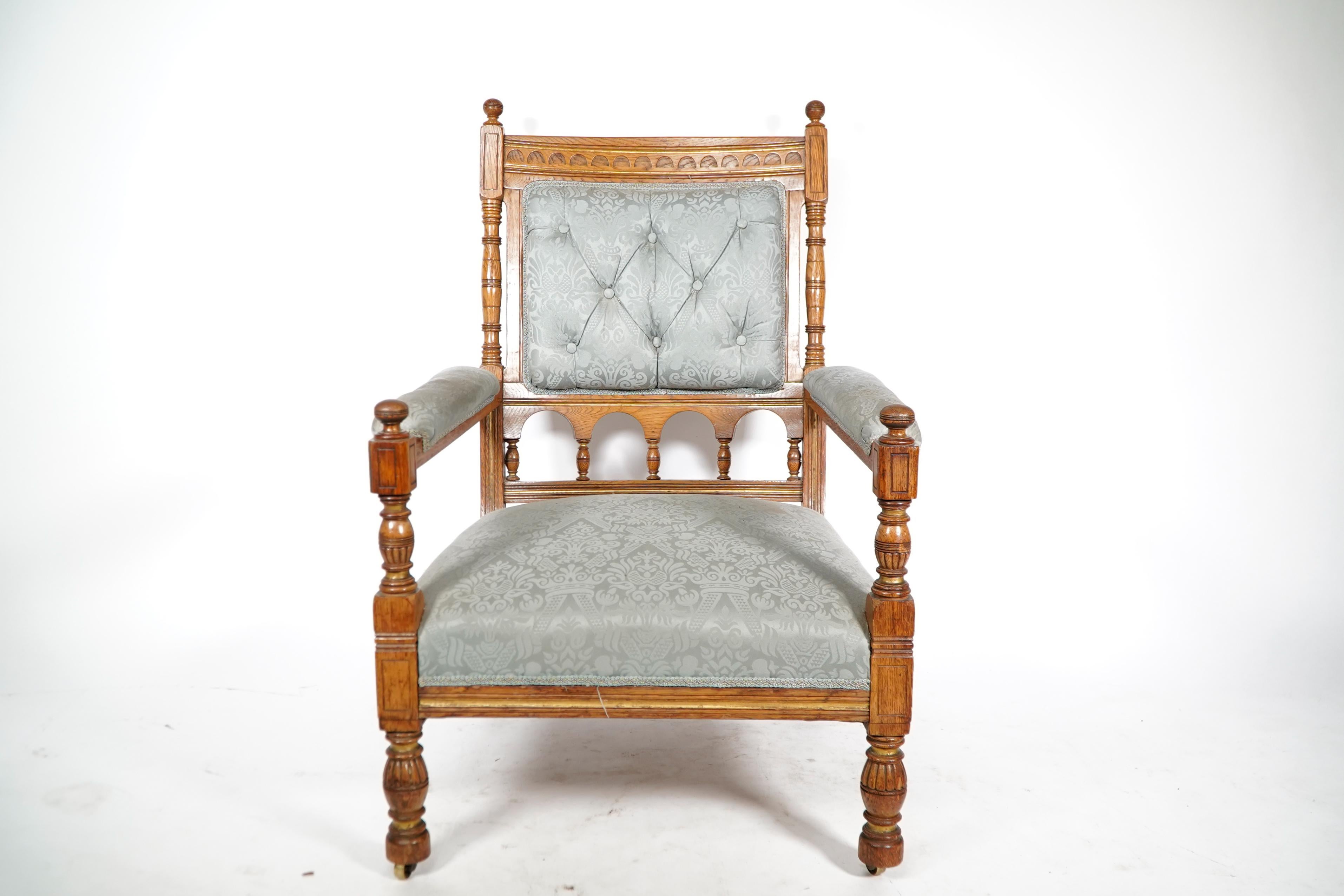 Bruce Talbert attributed, stamped Gillows. An Aesthetic Movement oak armchair. It was professionally re-upholstered in a light blue Damask.
