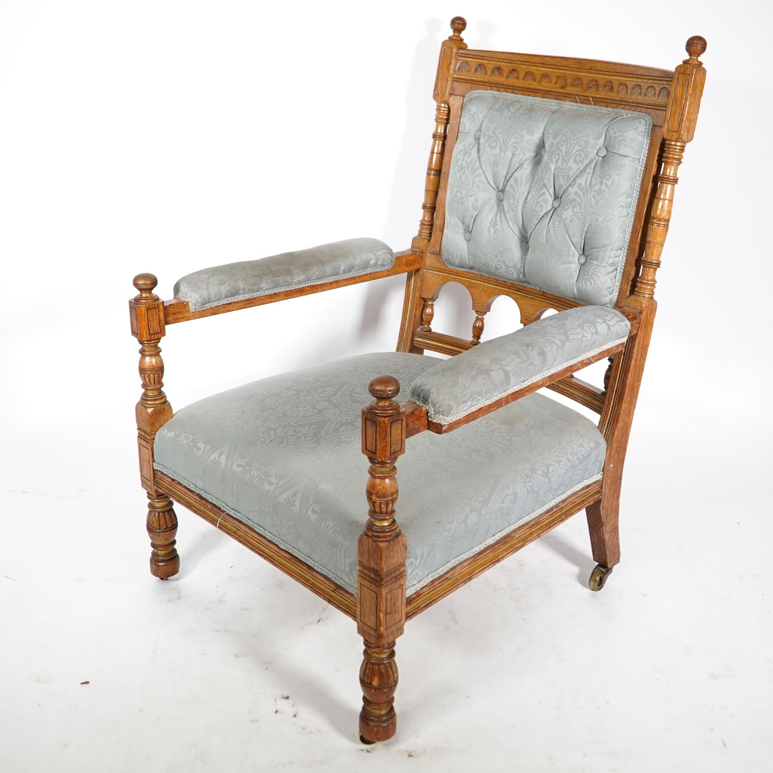 English Bruce Talbert, stamped Gillows. An Aesthetic Movement upholstered oak armchair. For Sale