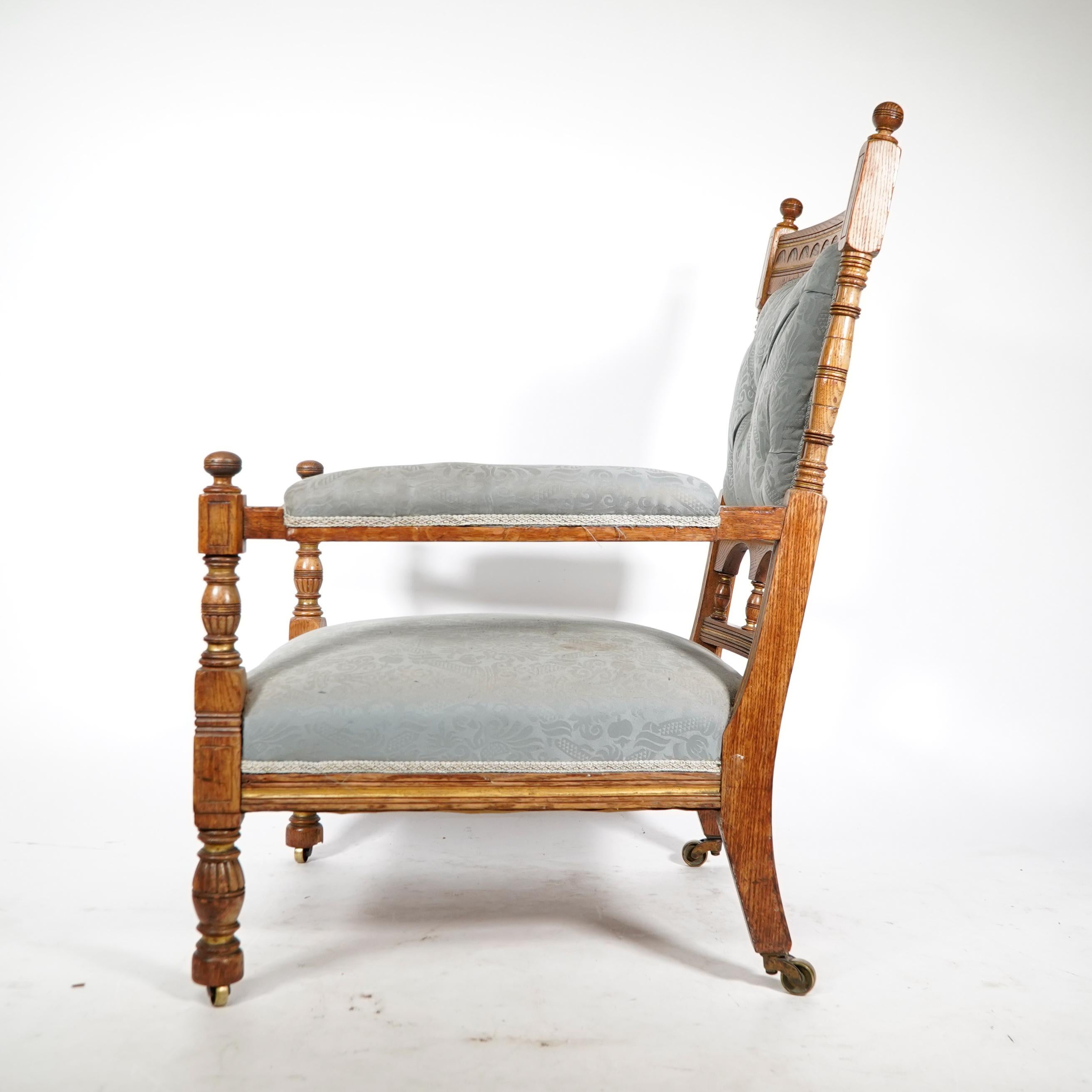 Bruce Talbert, stamped Gillows. An Aesthetic Movement upholstered oak armchair. In Good Condition For Sale In London, GB