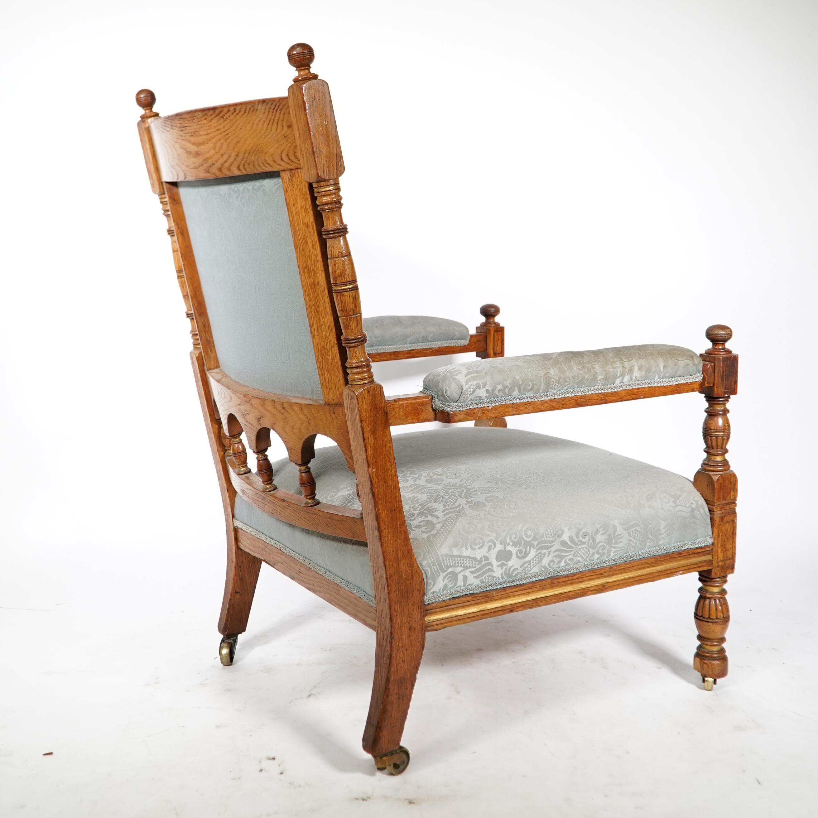 Late 19th Century Bruce Talbert, stamped Gillows. An Aesthetic Movement upholstered oak armchair. For Sale