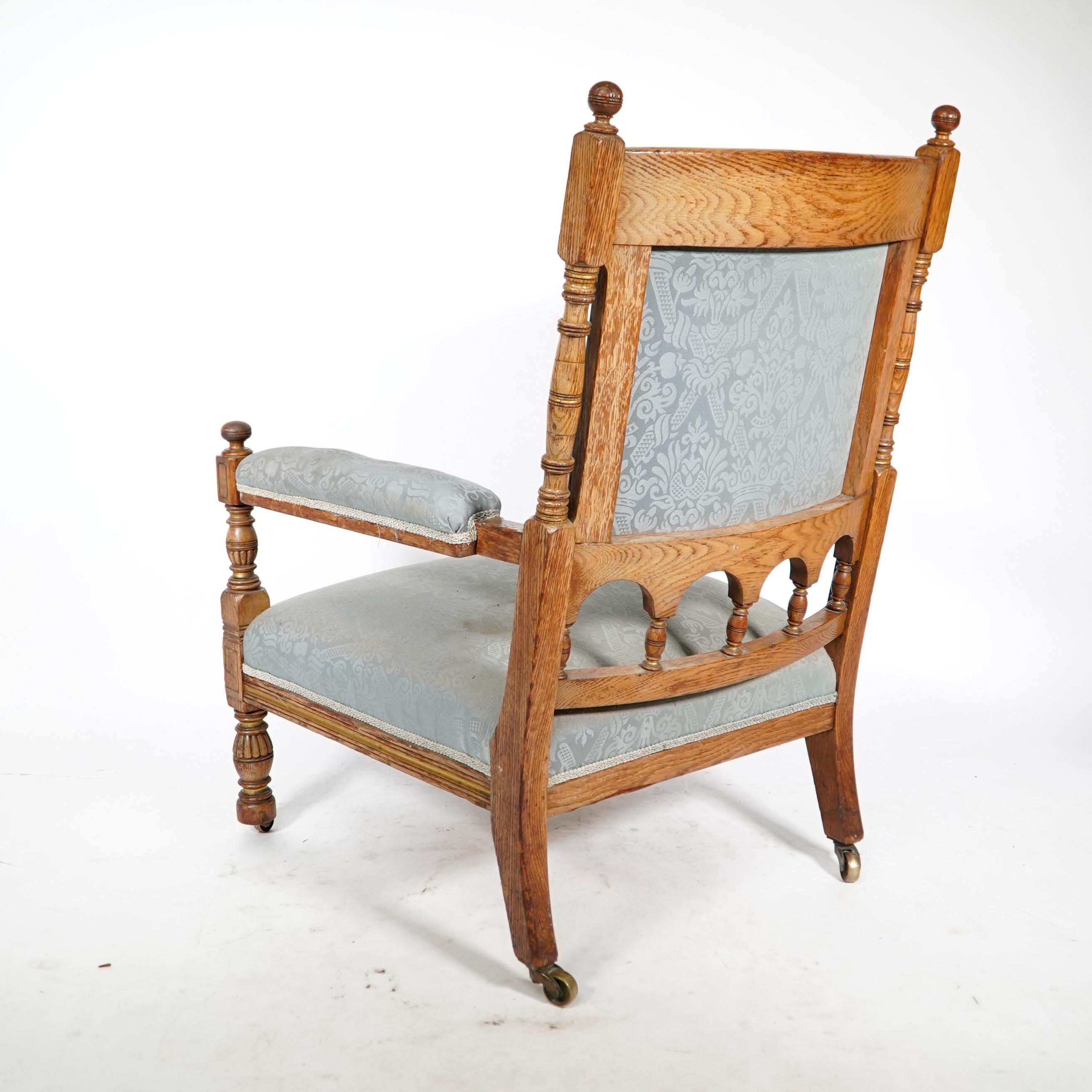 Oak Bruce Talbert, stamped Gillows. An Aesthetic Movement upholstered oak armchair. For Sale