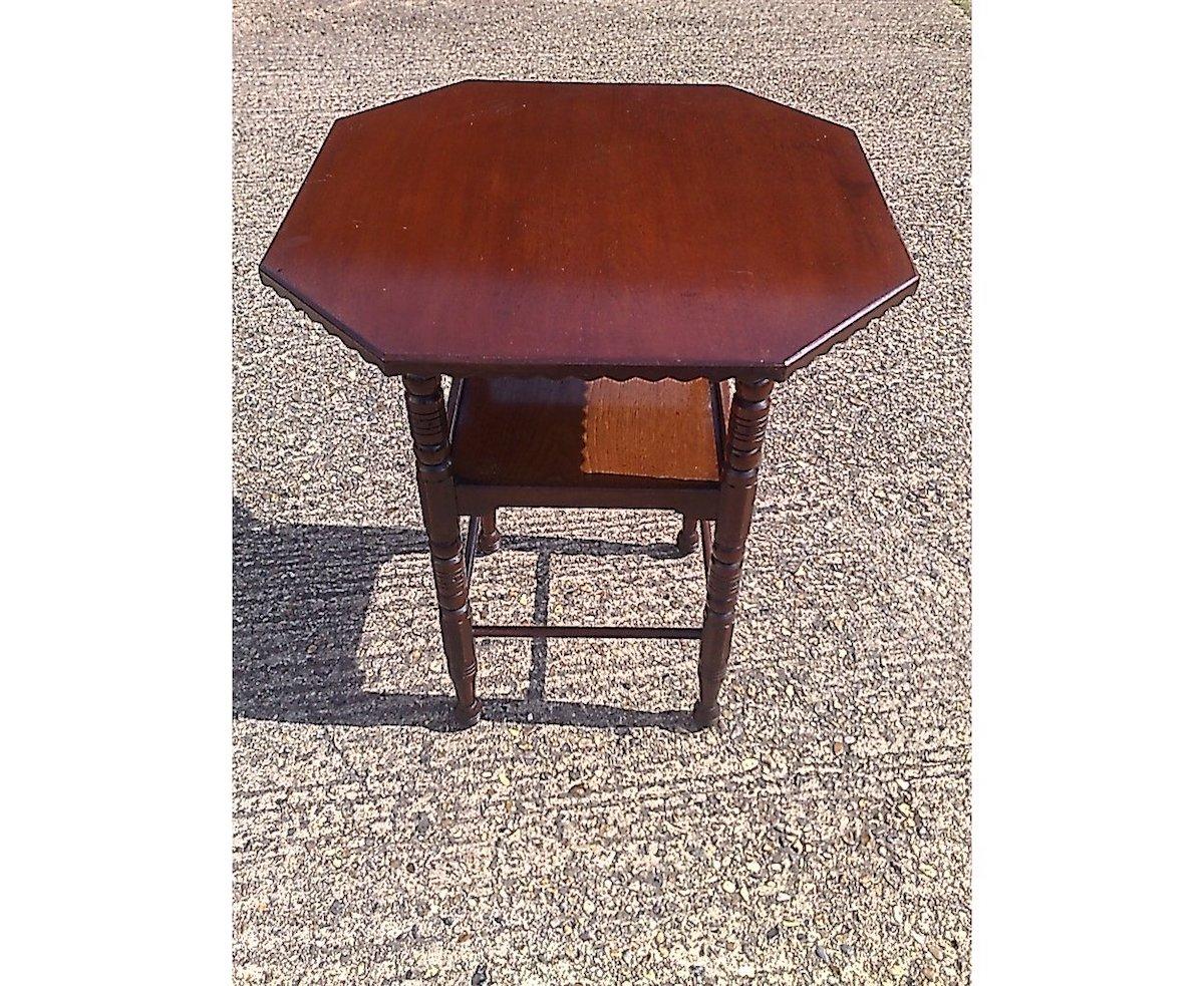 Bruce Talbert style of possibly made by Collier & Plunkett.
A fine quality aesthetic movement walnut side table with chip carved 45 degree details to the under side of the top and very precise scroll carved details to the protruding top supports.