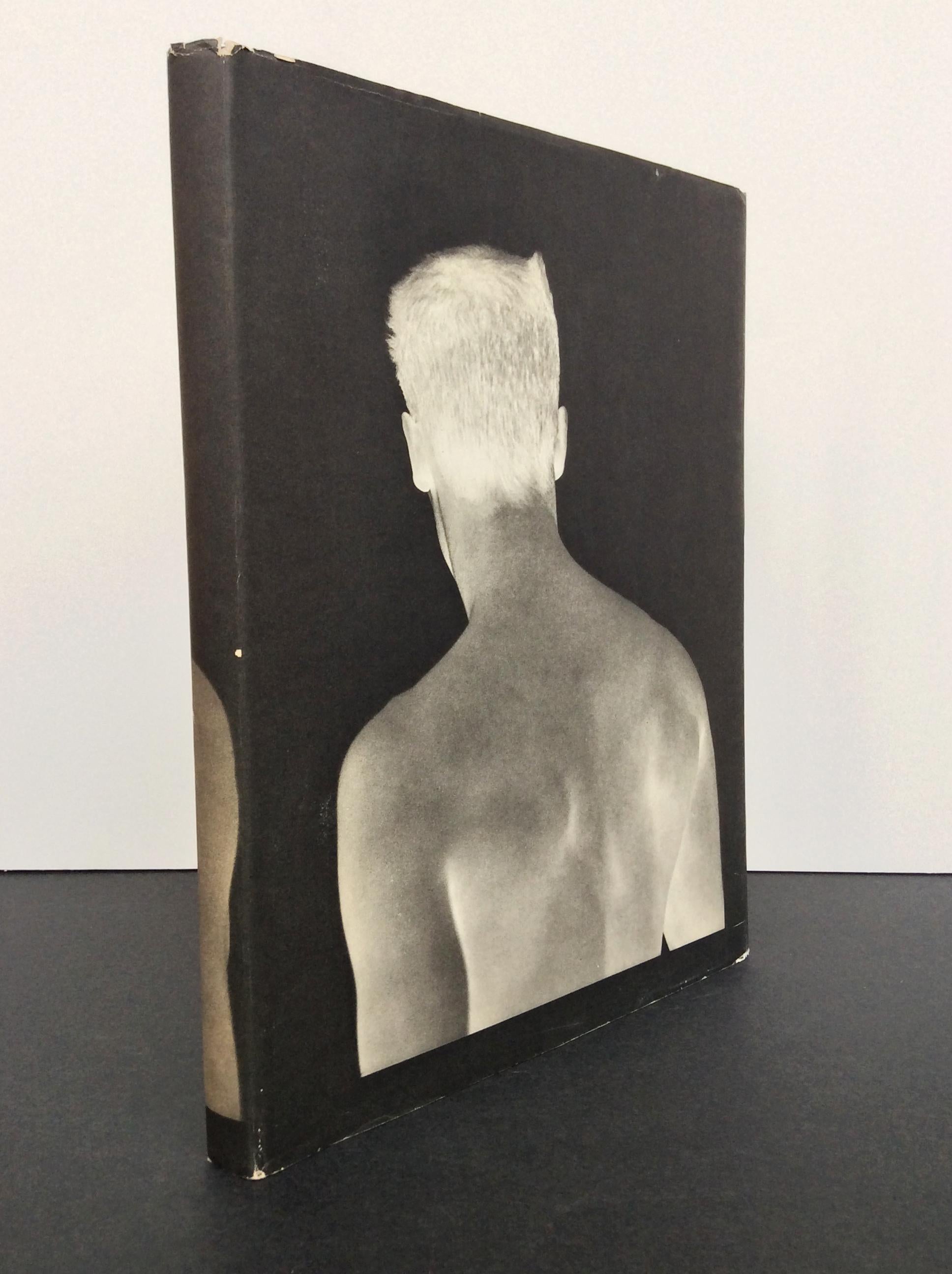 A beautifully conceptualized book of portraits by the photographer Bruce Webber. This hardbound book was published by Twelvetrees Press in 1983. The cover is elegantly wrapped in blue linen and protected by a dust jacket. Webber's photographs are